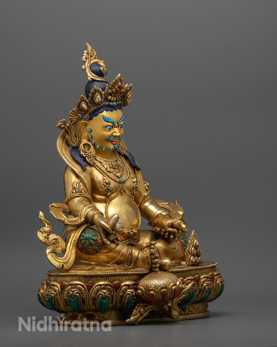 traditional Nepalese Jambhala sculpture with vibrant acrylic colors.