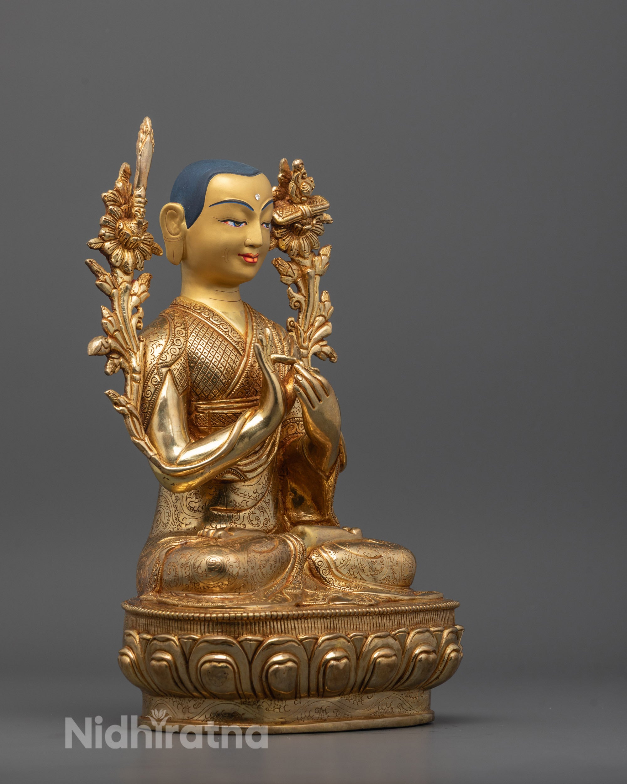 Side profile showing detailed robes and fire gold gilding on Je Tsongkhapa statue