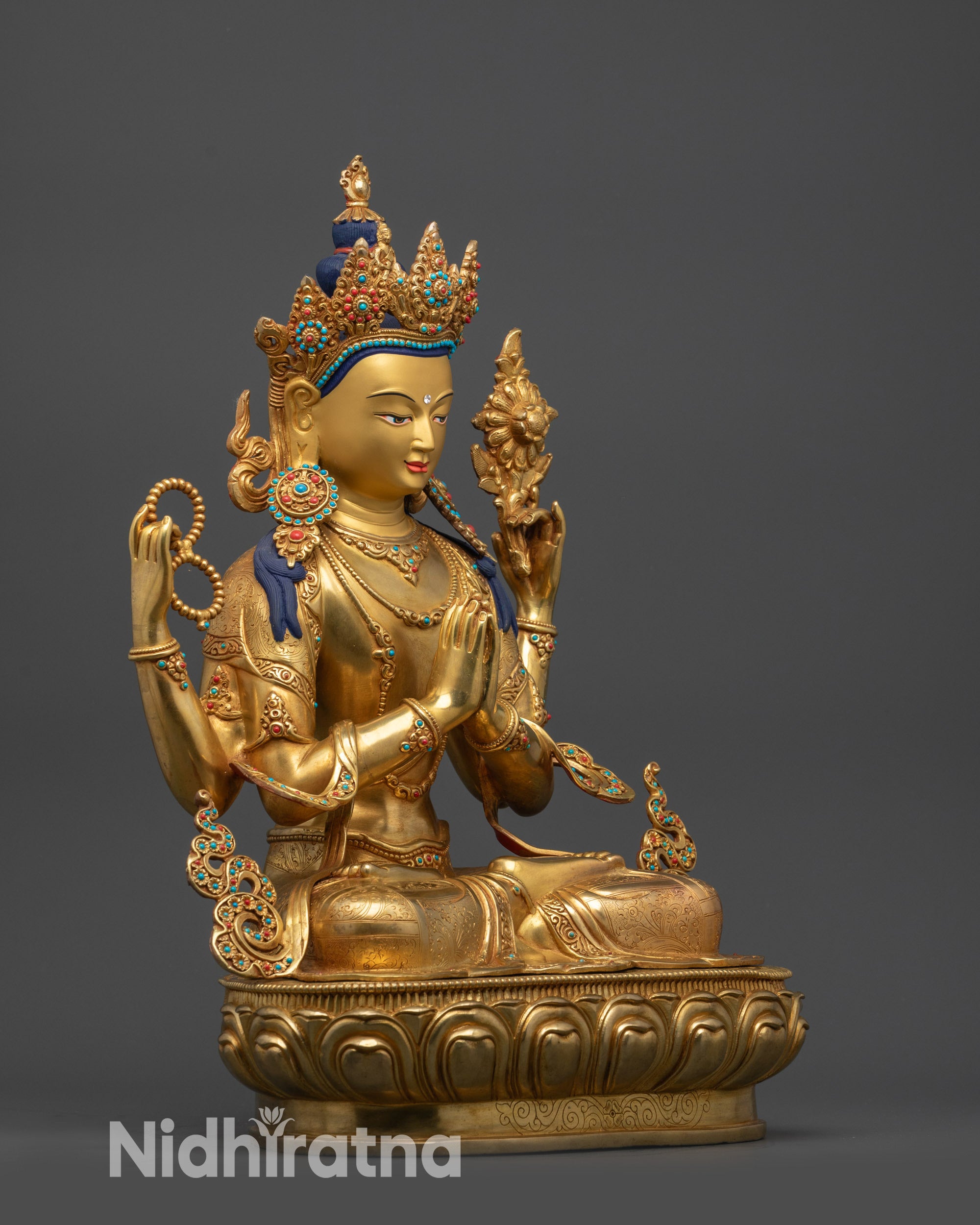 Side view Chenrezig Statue showing intricate carvinrezig Statue showing intricate carvings and double-layered lotus pedestal