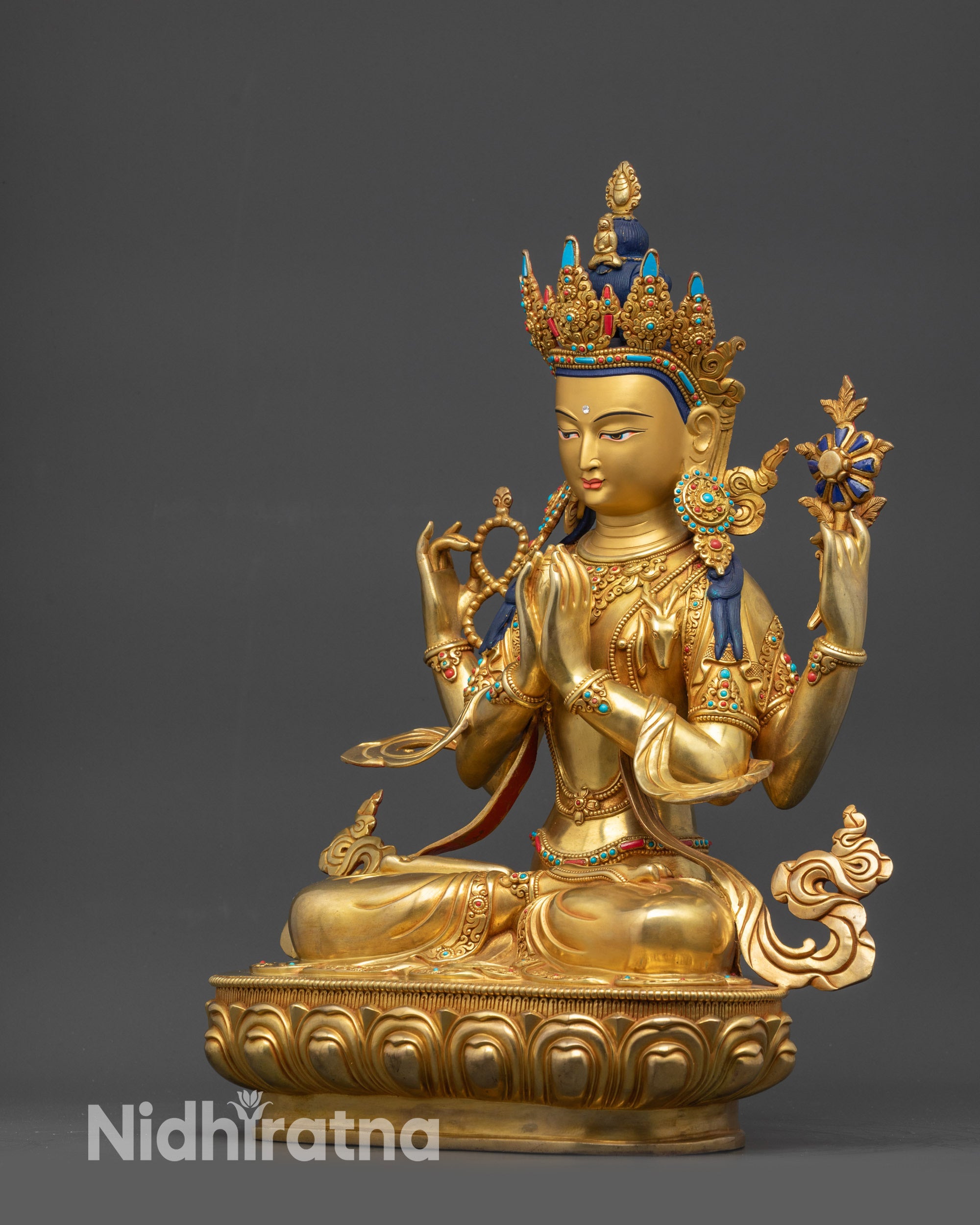 Side view Chenrezig Statue with visible sacred objects and ornaments