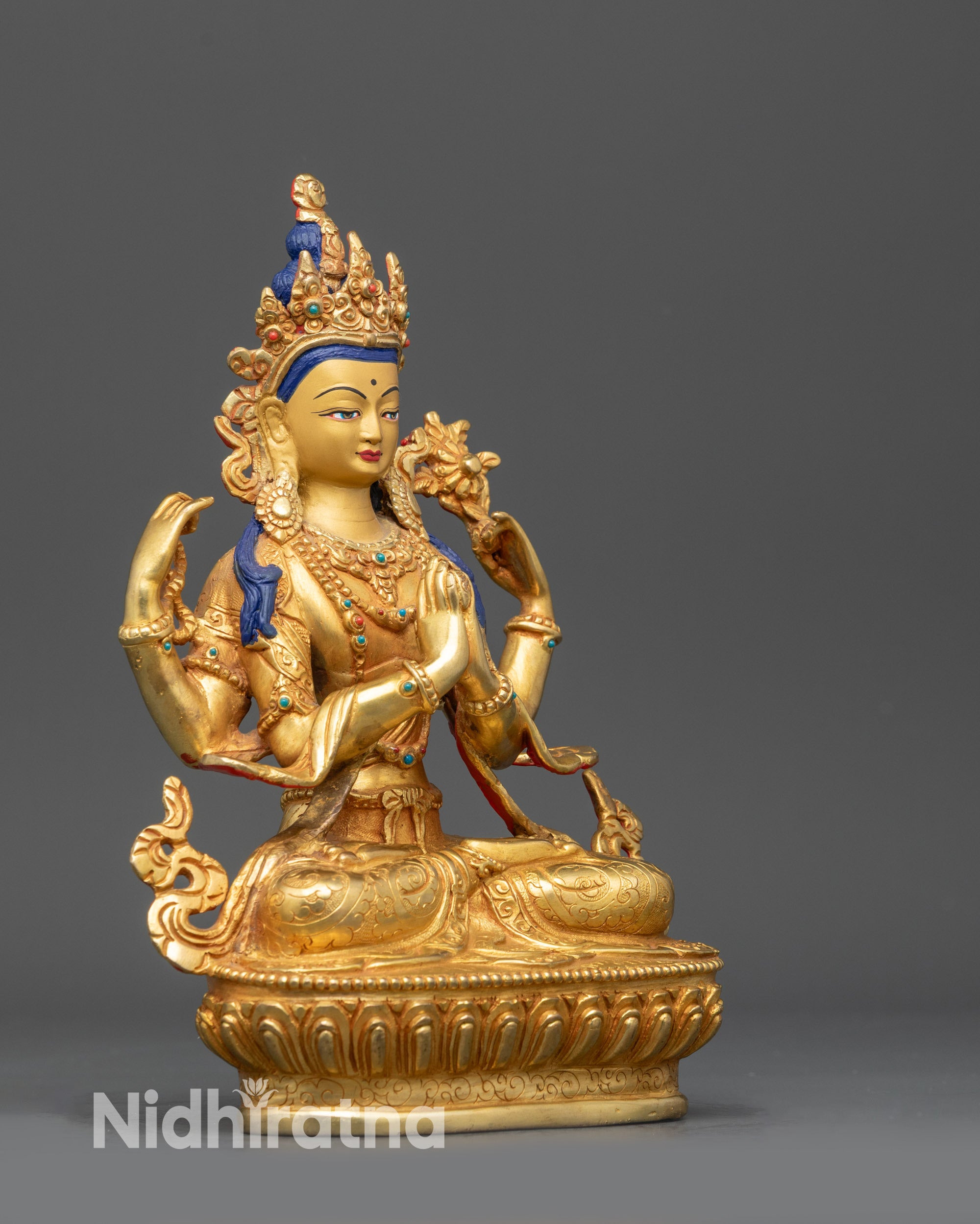 Side view Chenrezig holding crystal rosary and utpala flower with chintamani