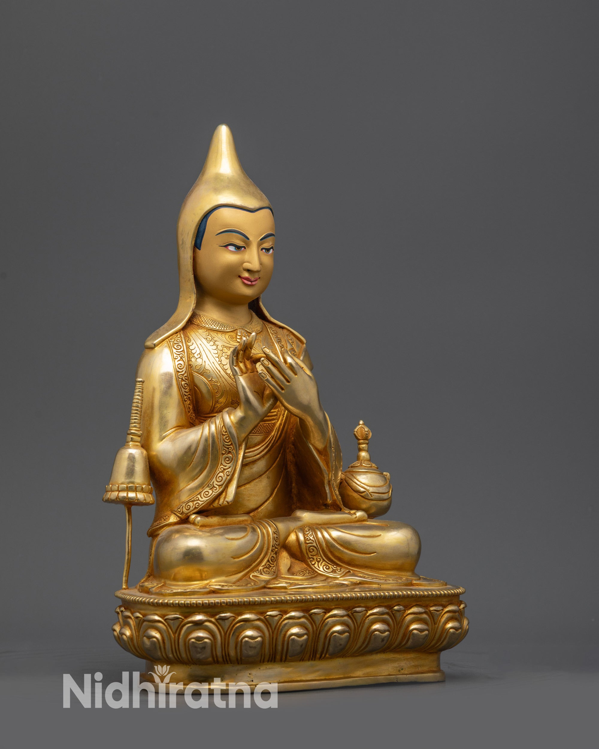 Side view Dipankara Atisha statue with stupa and vajra-crowned vase details