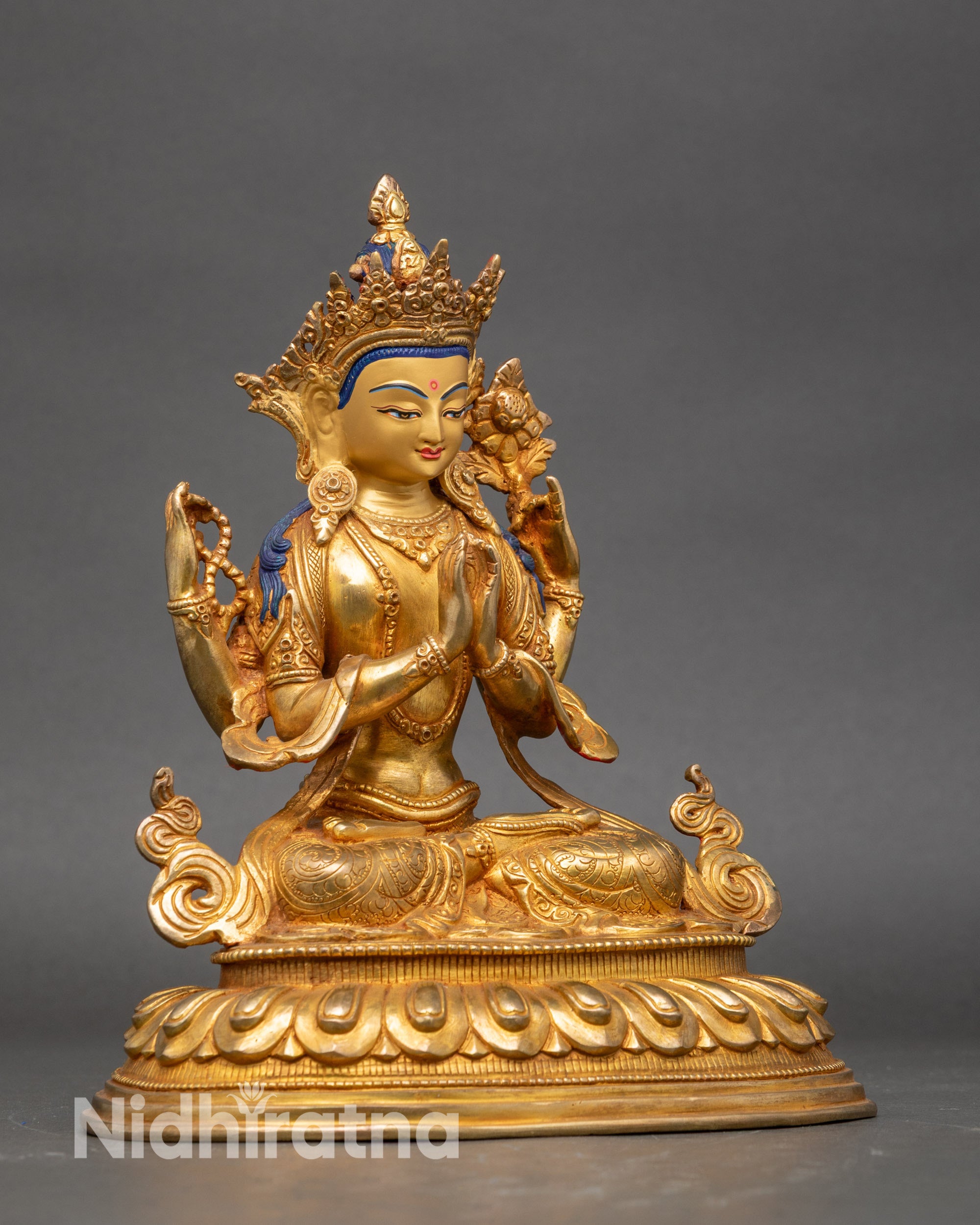 Side view Four-Armed Avalokiteshvara holding lotus, mala, vase, and jewel