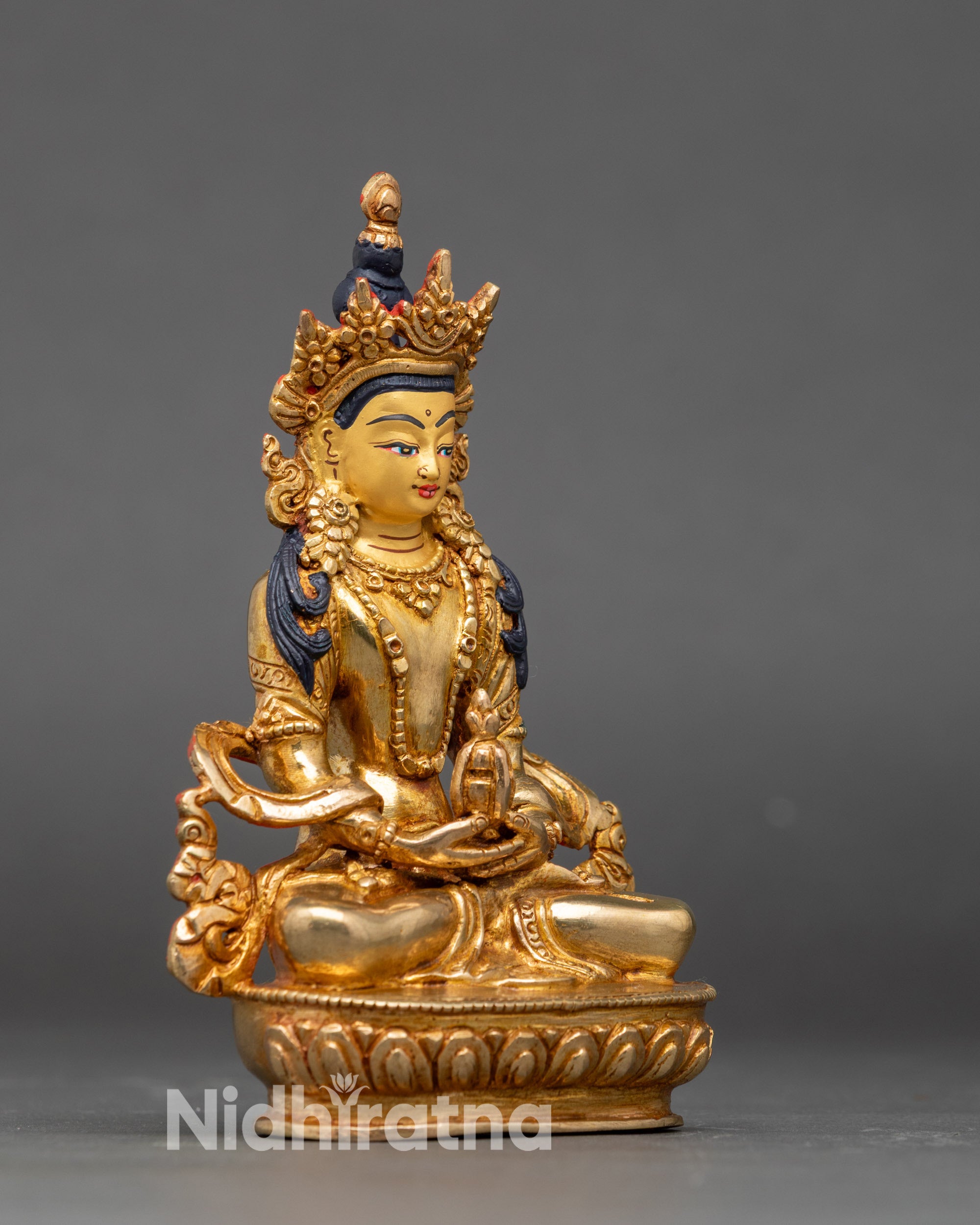 Side view Golden Amitayus statue meditative pose longevity and healing mudras