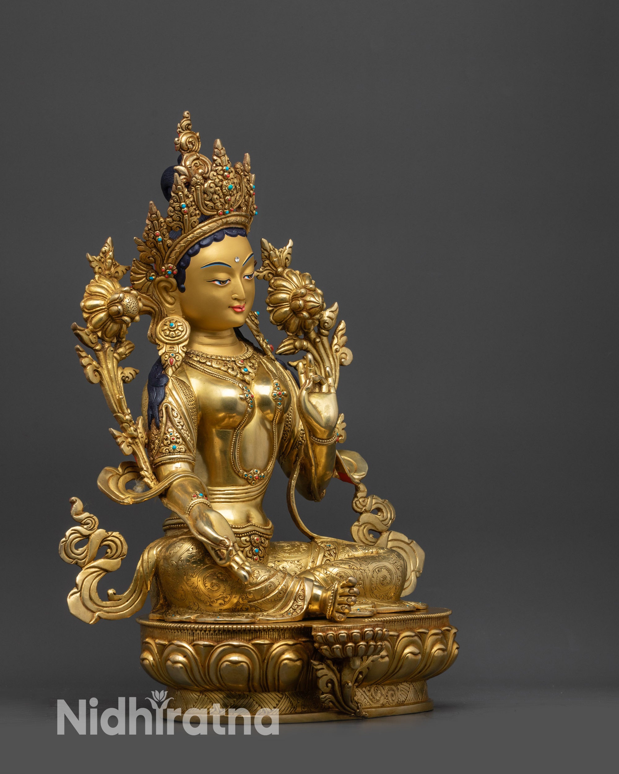 Side view Green Tara Statue holding Utpala flower with Varada and Vitarka mudras