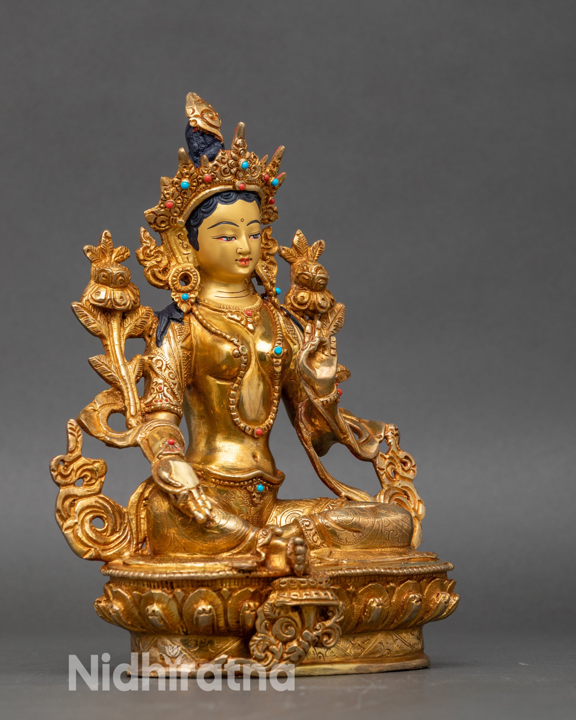 Side view Green Tara Statue – seated on lotus throne with right leg forward on lotus