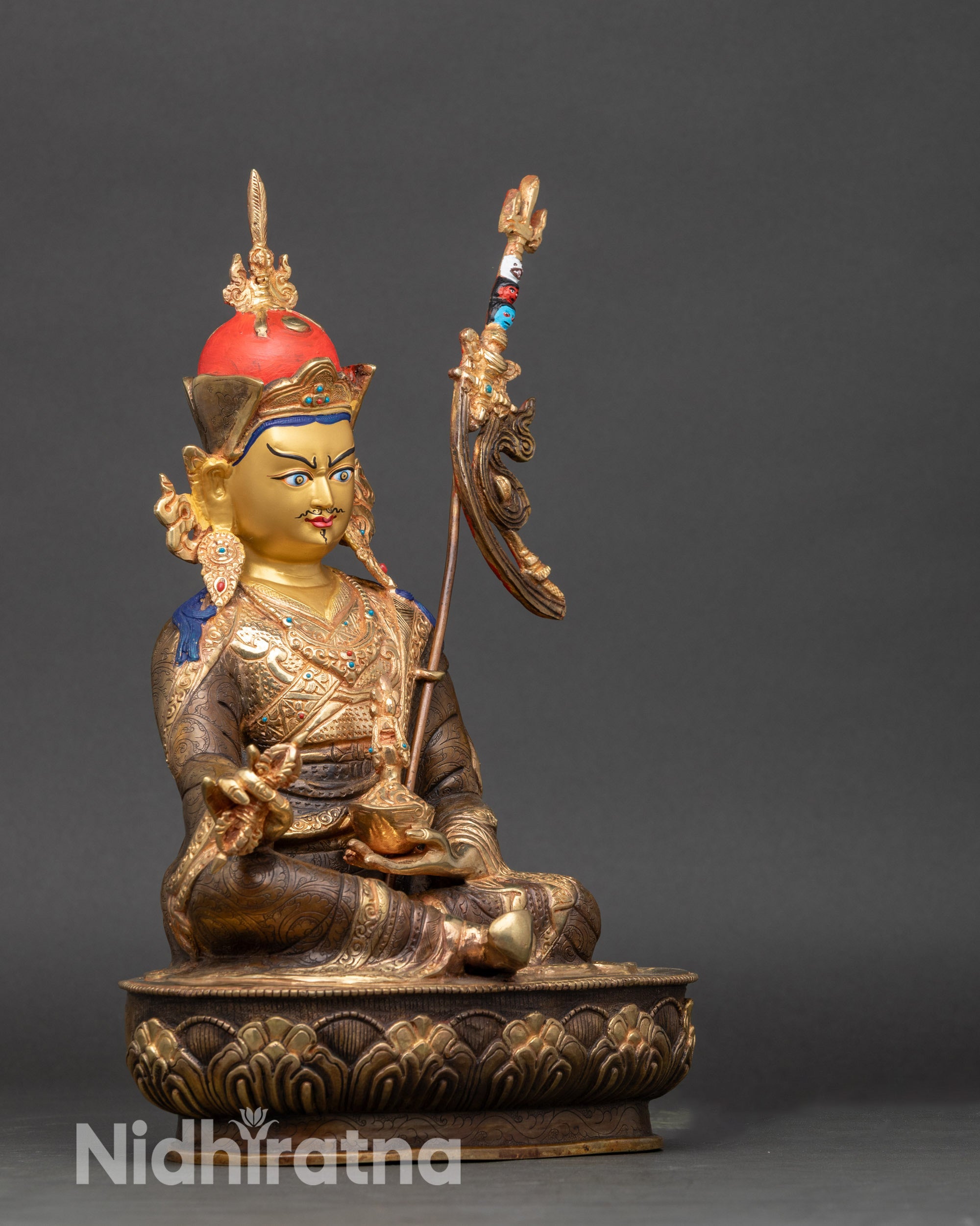Side view Guru Rinpoche statue with khatvanga | traditional Himalayan artisan work