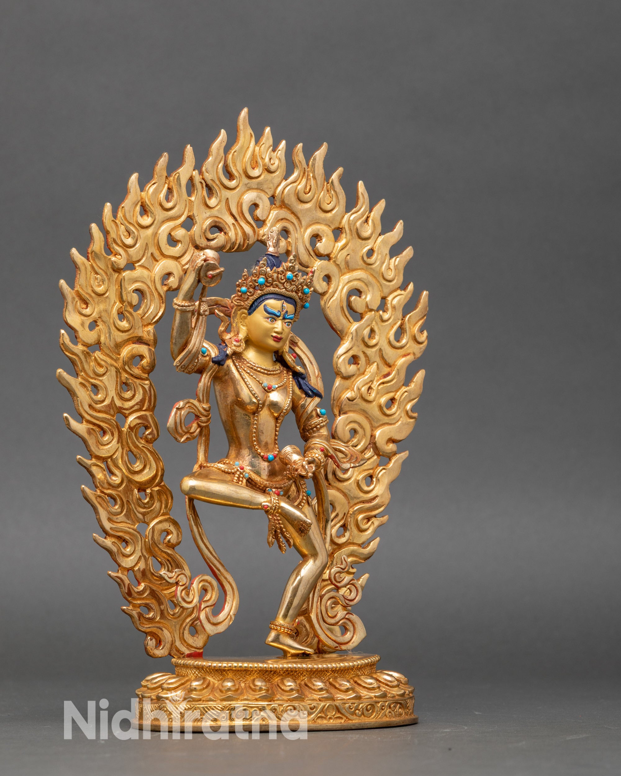Side view Machig Labdron holding damaru and ritual bell lotus seat sculpture