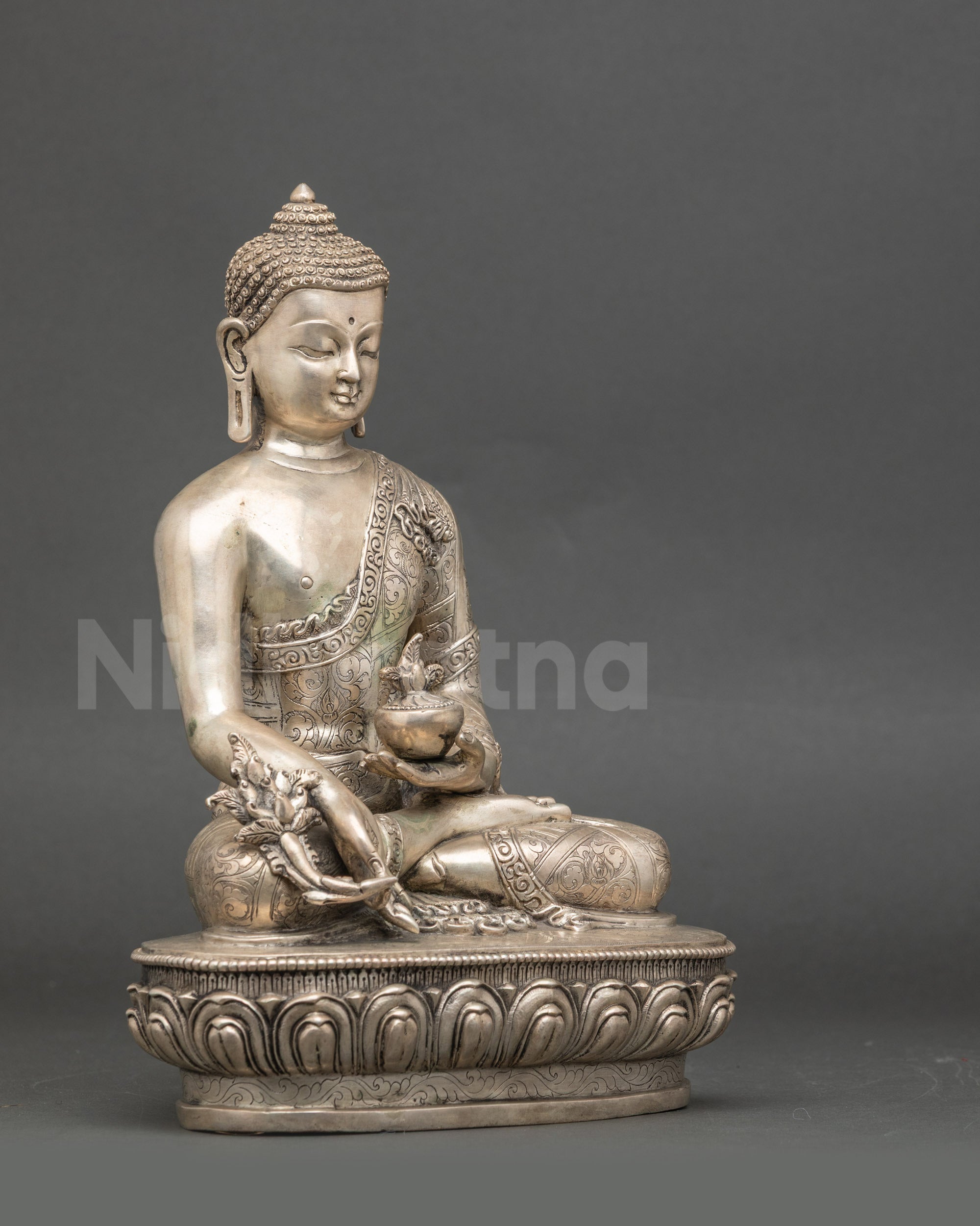 Side view Medicine Buddha statue, silver-plated Newari handcrafted meditation figure