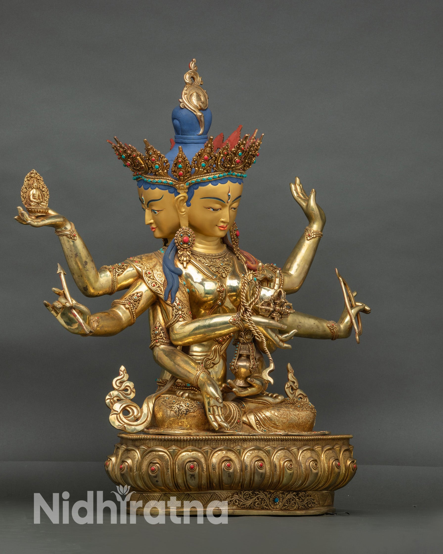 Side view Namgyalma holding Vishva Dorje, vase, bow, and Buddha lotus throne
