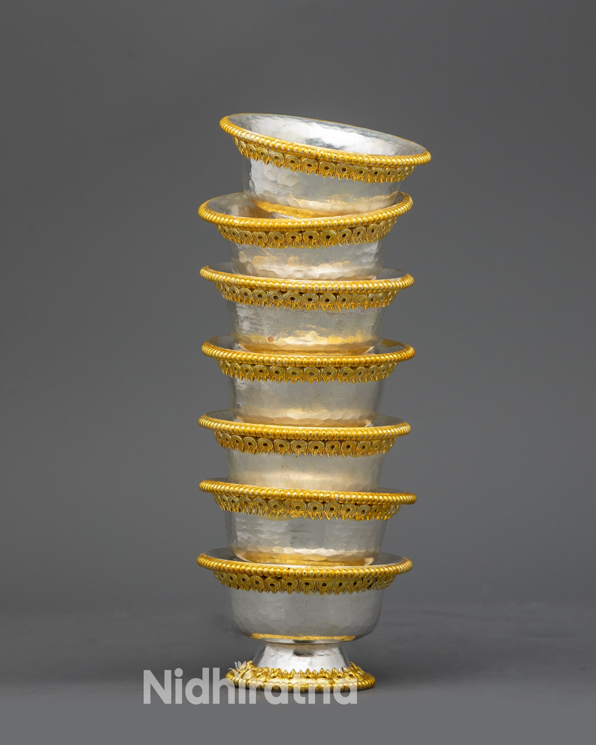 Side view Seven Water Offering Bowls, traditional Himalayan copper ritual vessel