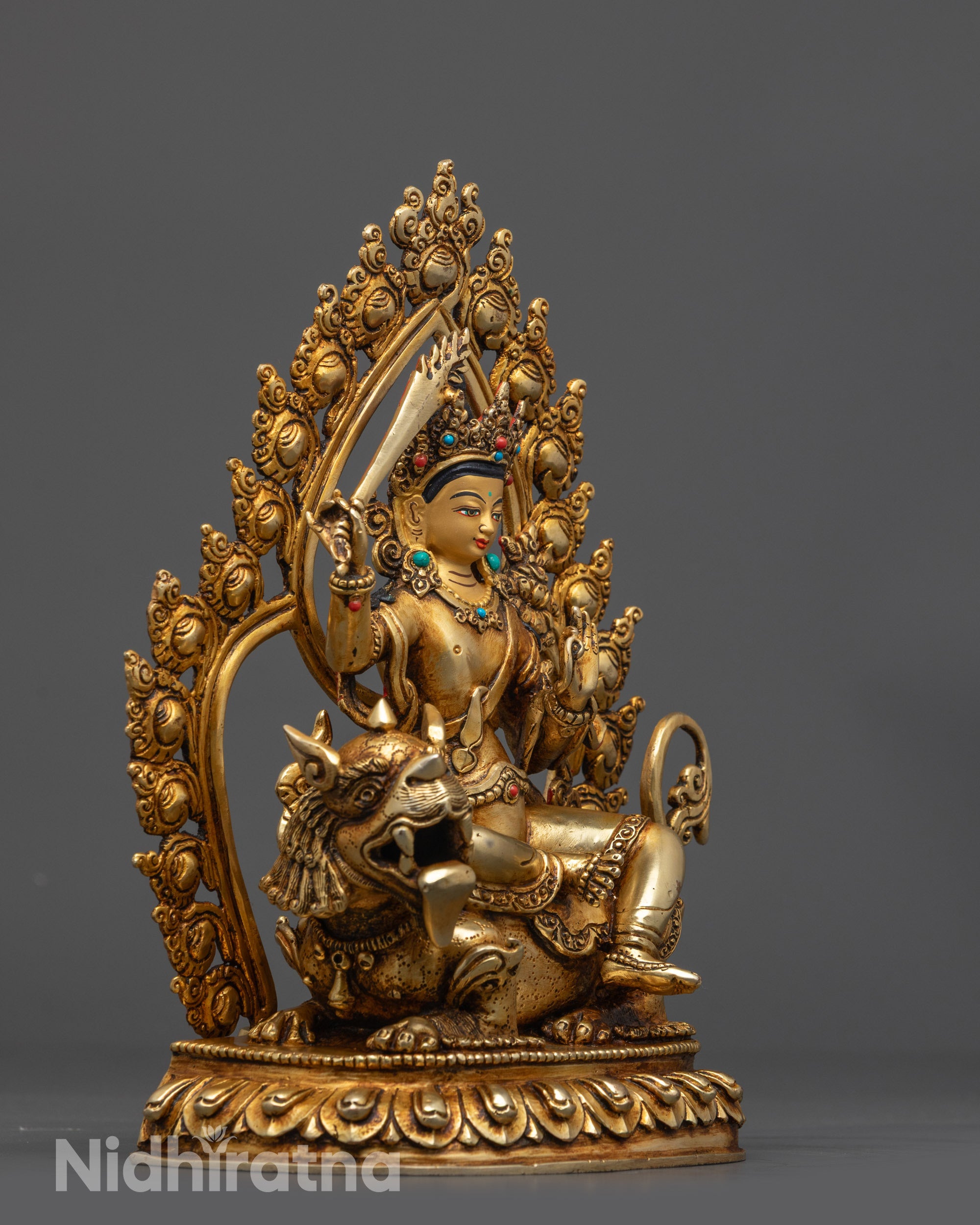 Side view Simhada Manjushri Statue highlighting utpala flower and Prajnaparamita scripture
