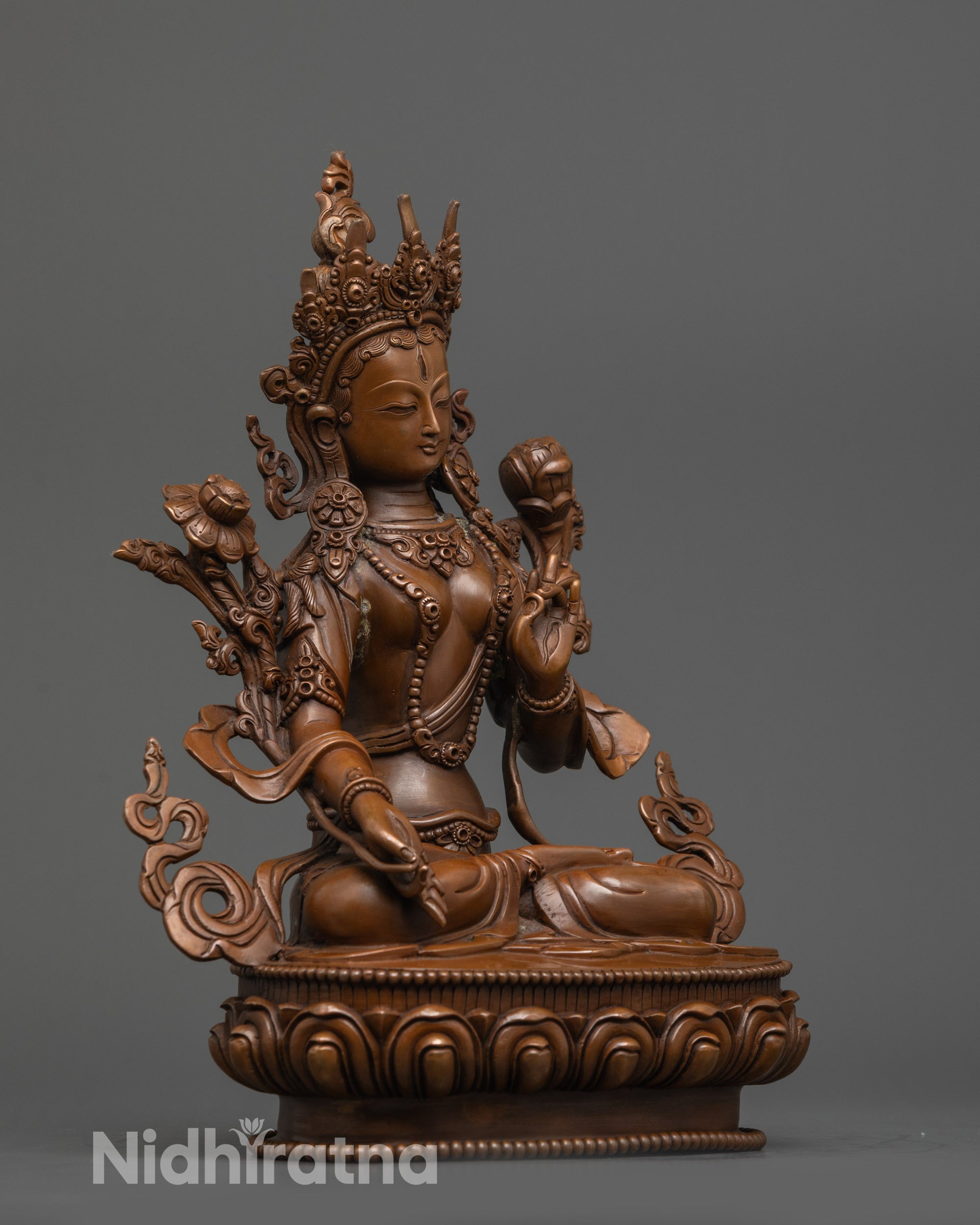 Side view Sita Tara Statue holding utpala flower seated on lotus throne with jewelry