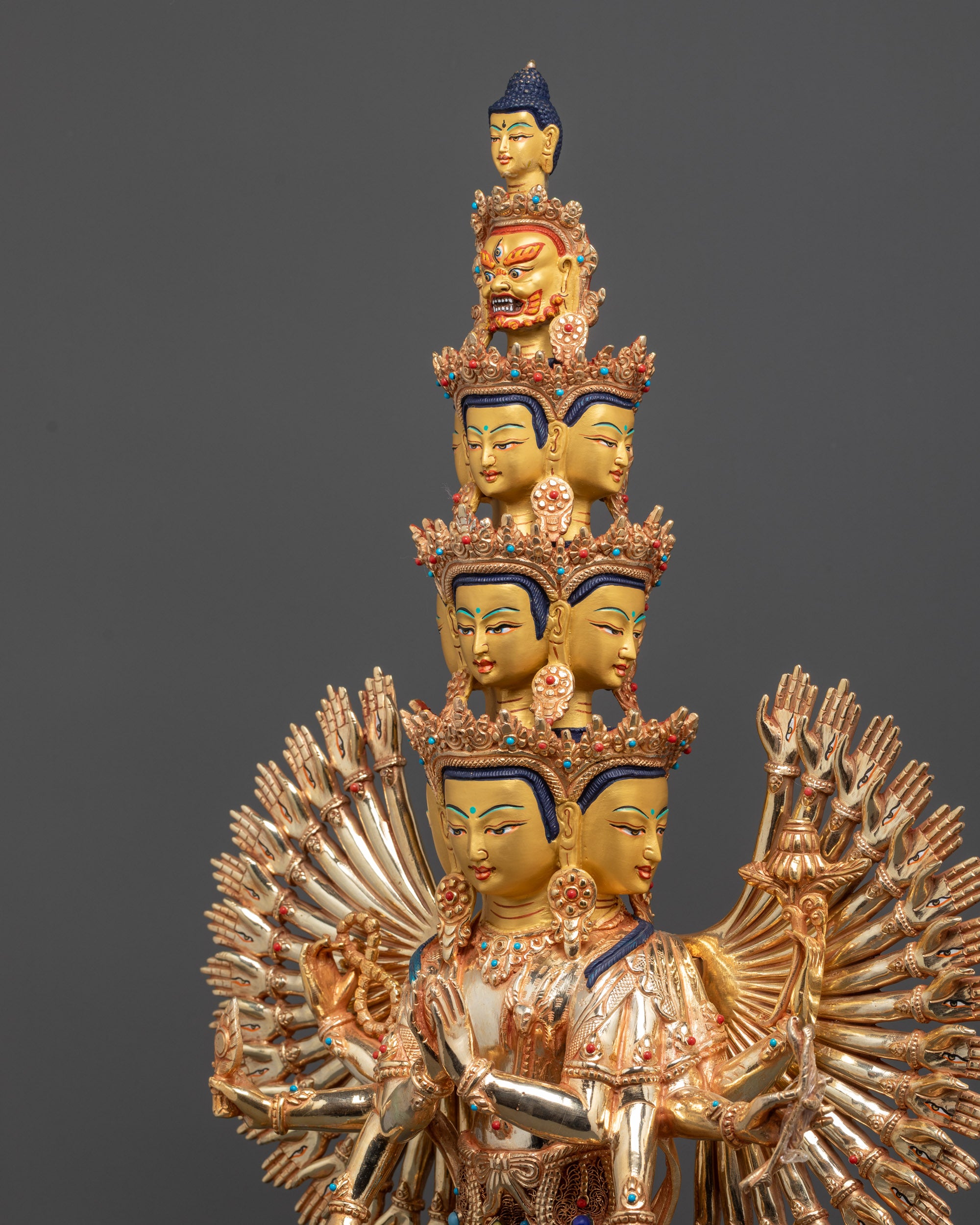 Side view Thousand-Armed Avalokiteshvara showing carved arms, robes, and halo motifs
