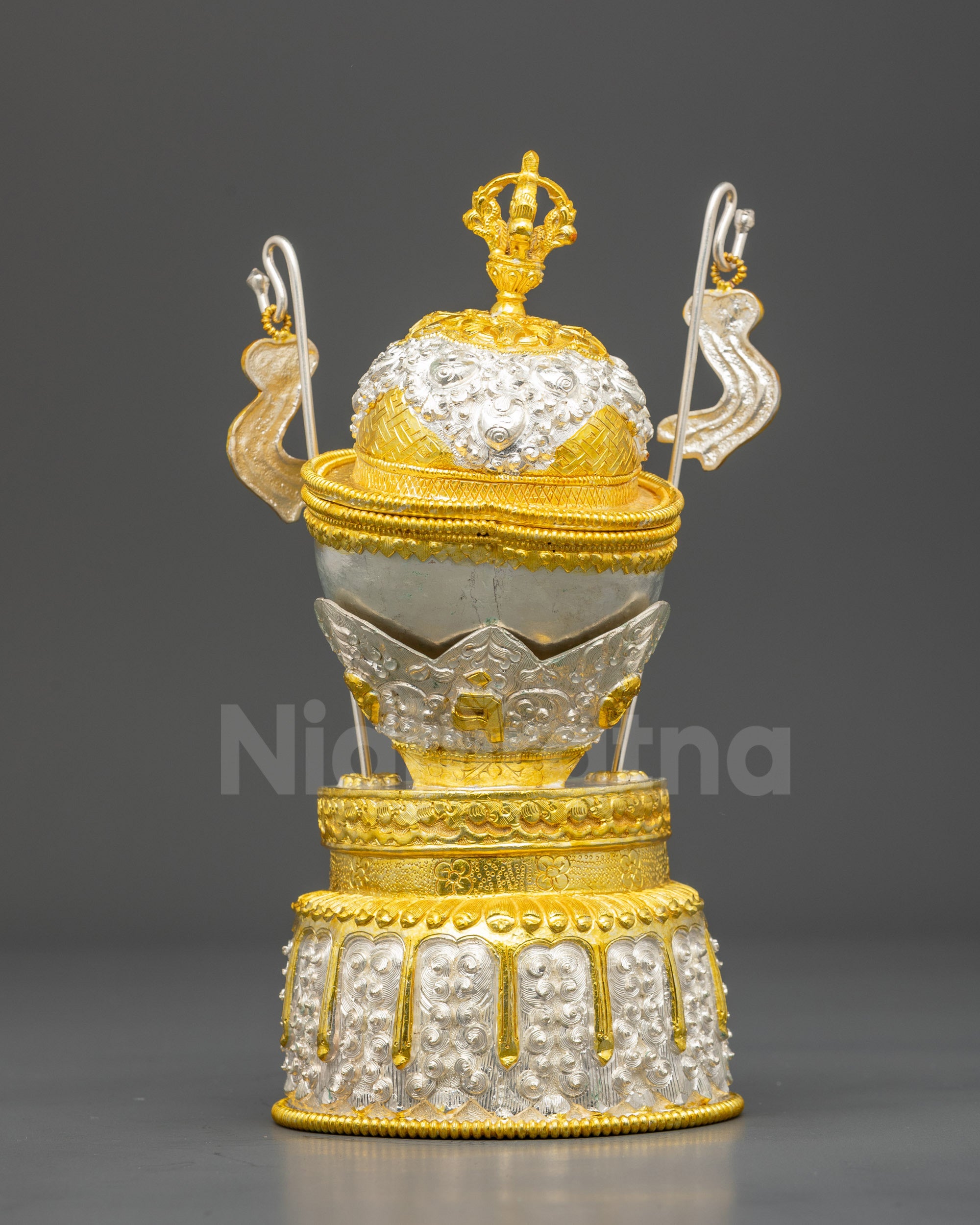 Side view Tibetan Kapala copper base with gold-plated half vajra lid and filigree design