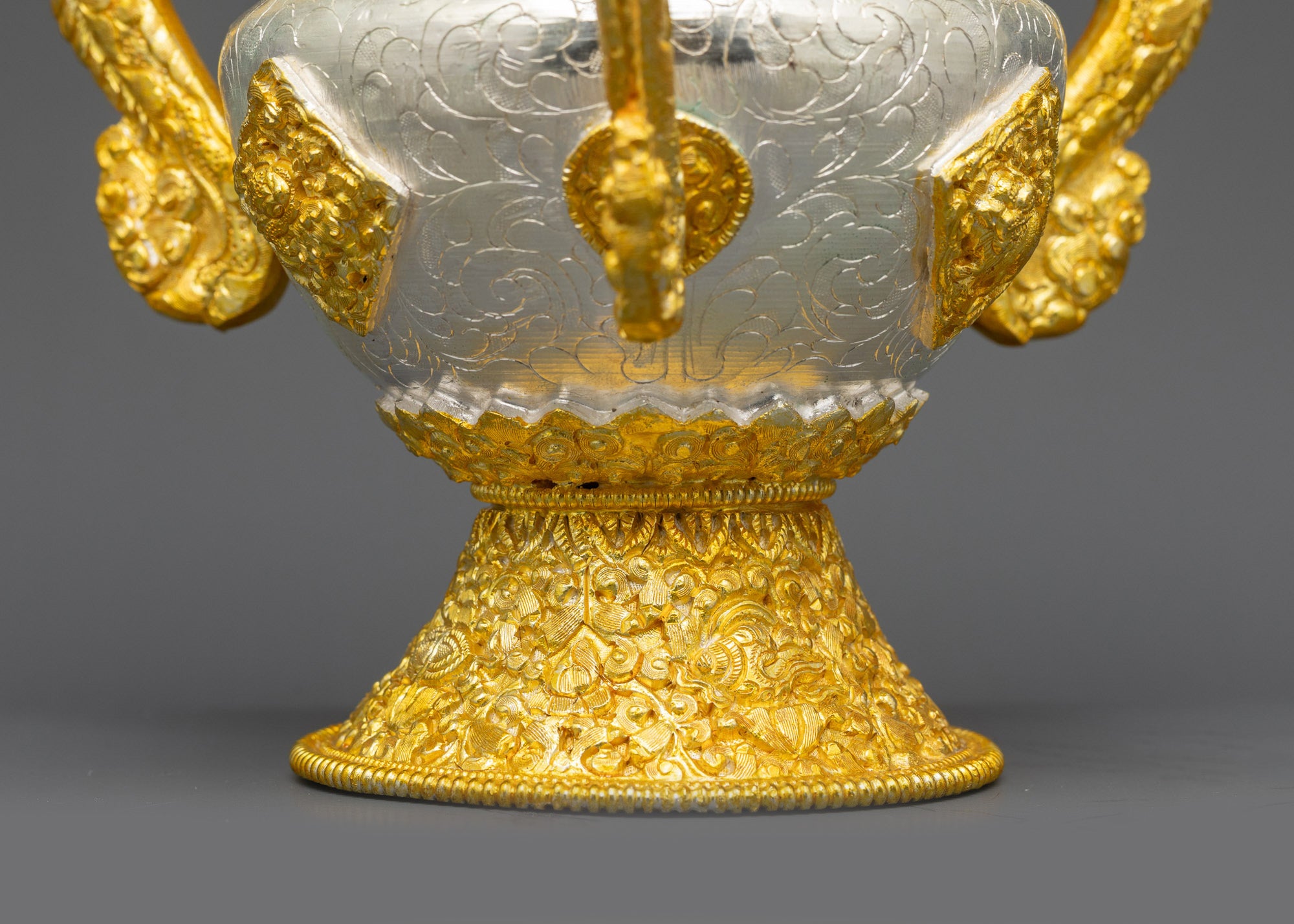 Side view Tibetan Sangbour ritual set showing curved copper body and braided hangings