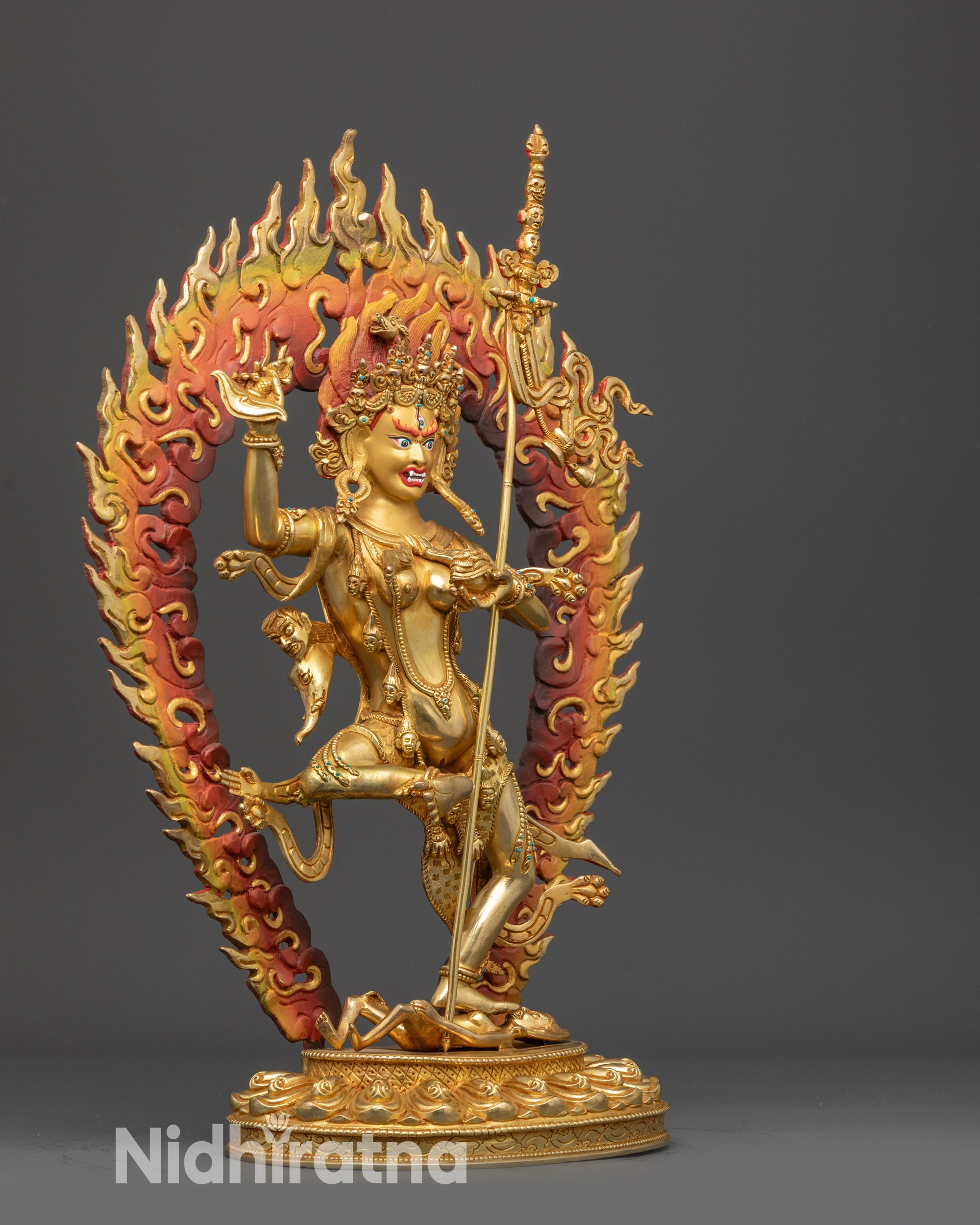 Side view Troma Nangmo Dakini with swirling robes, kartika knife, and khatvanga trident