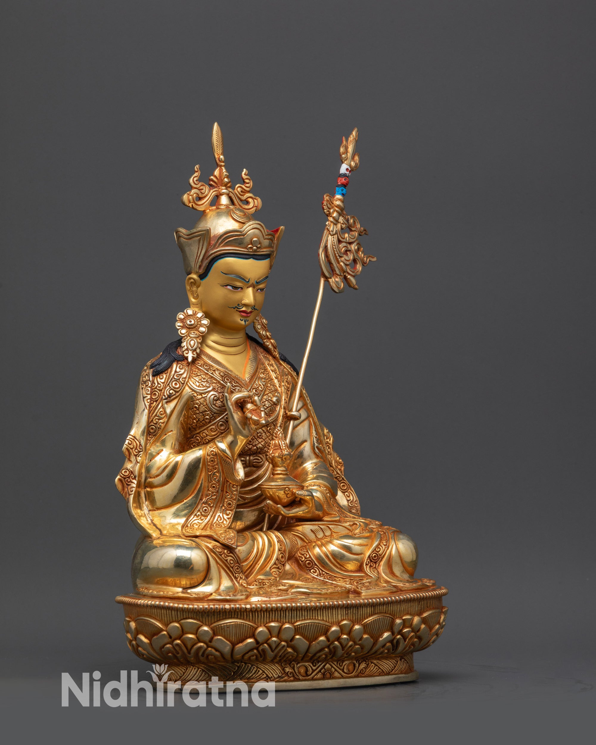 Side view Tsokye Dorje holding vajra and skull cup with khatvanga staff on shoulder