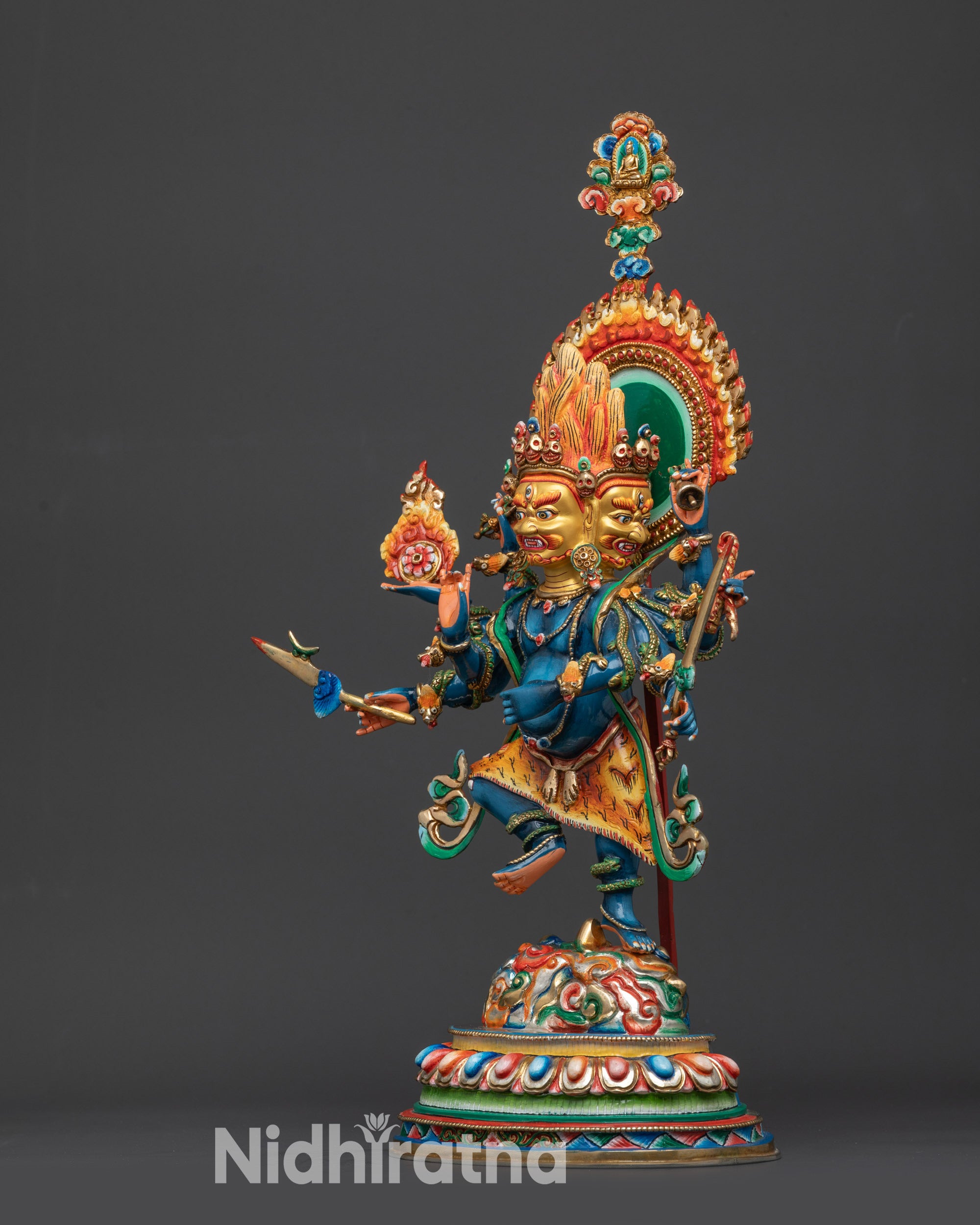 Side view Ucchusma statue showing dynamic posture and multi-armed ritual design
