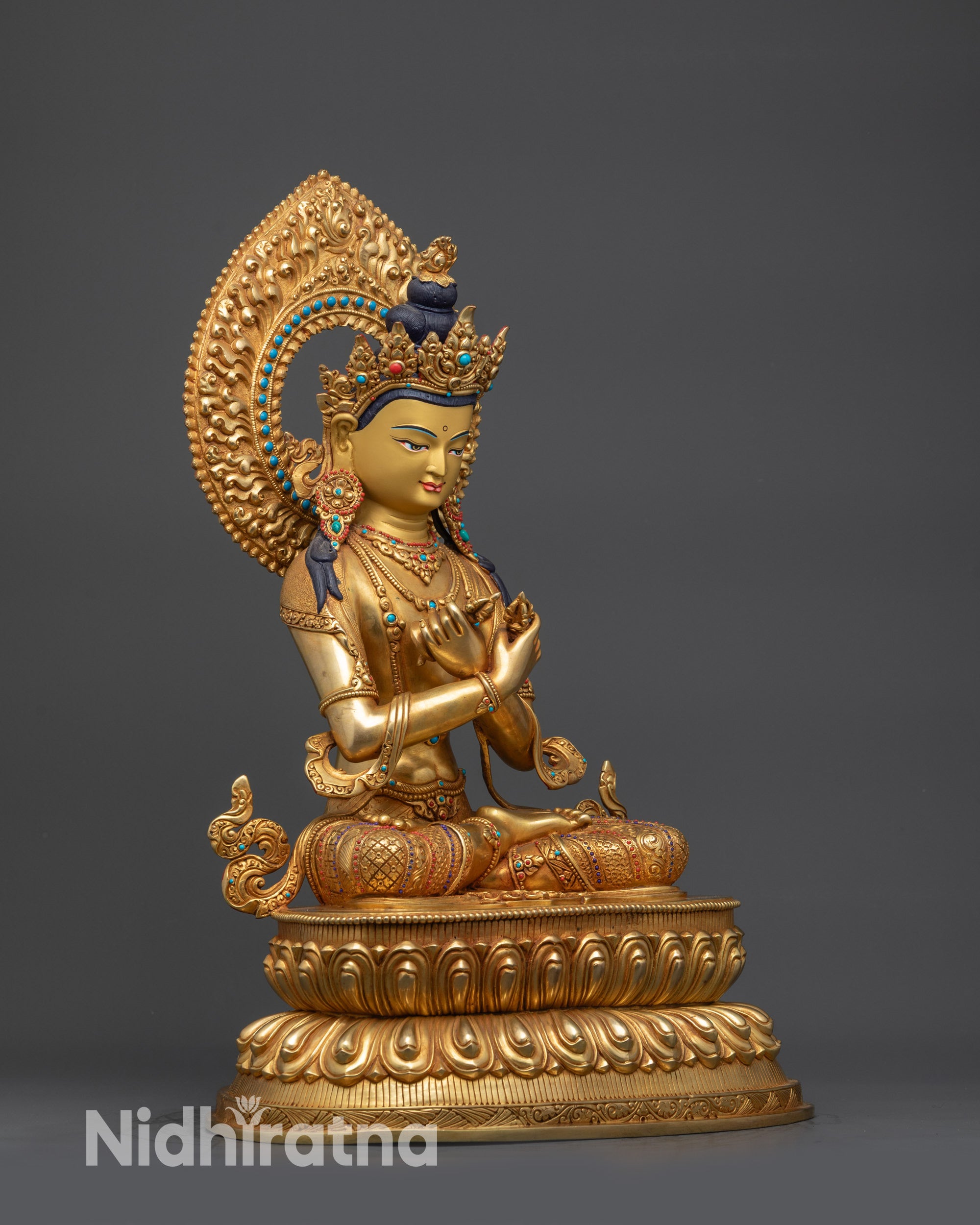 Side view Vajradhara Buddha sculpture with Vajra, Bell, and intricate halo patterns