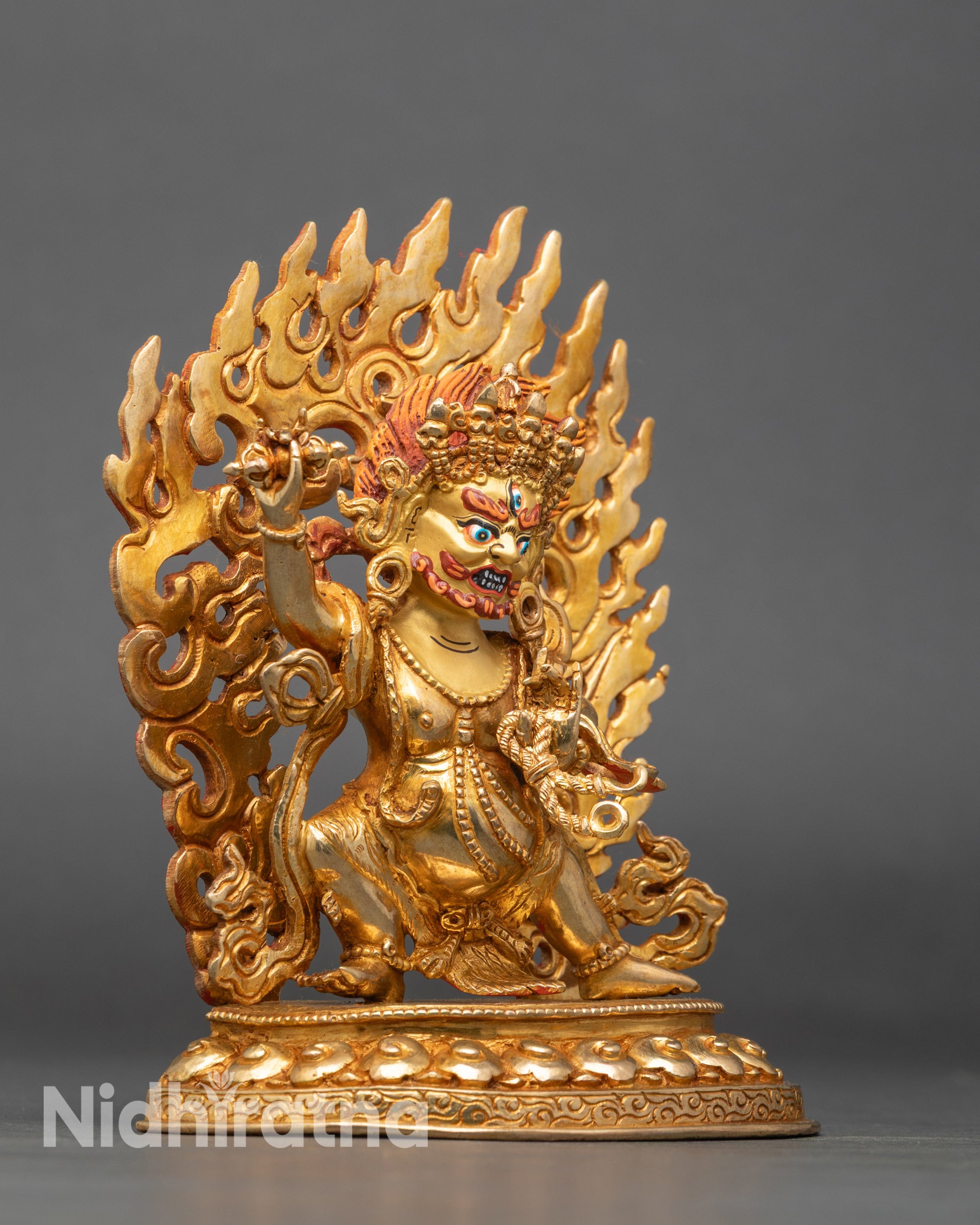 Side view Vajrapani Chana Dorje statue vajra and lasso meditation pose