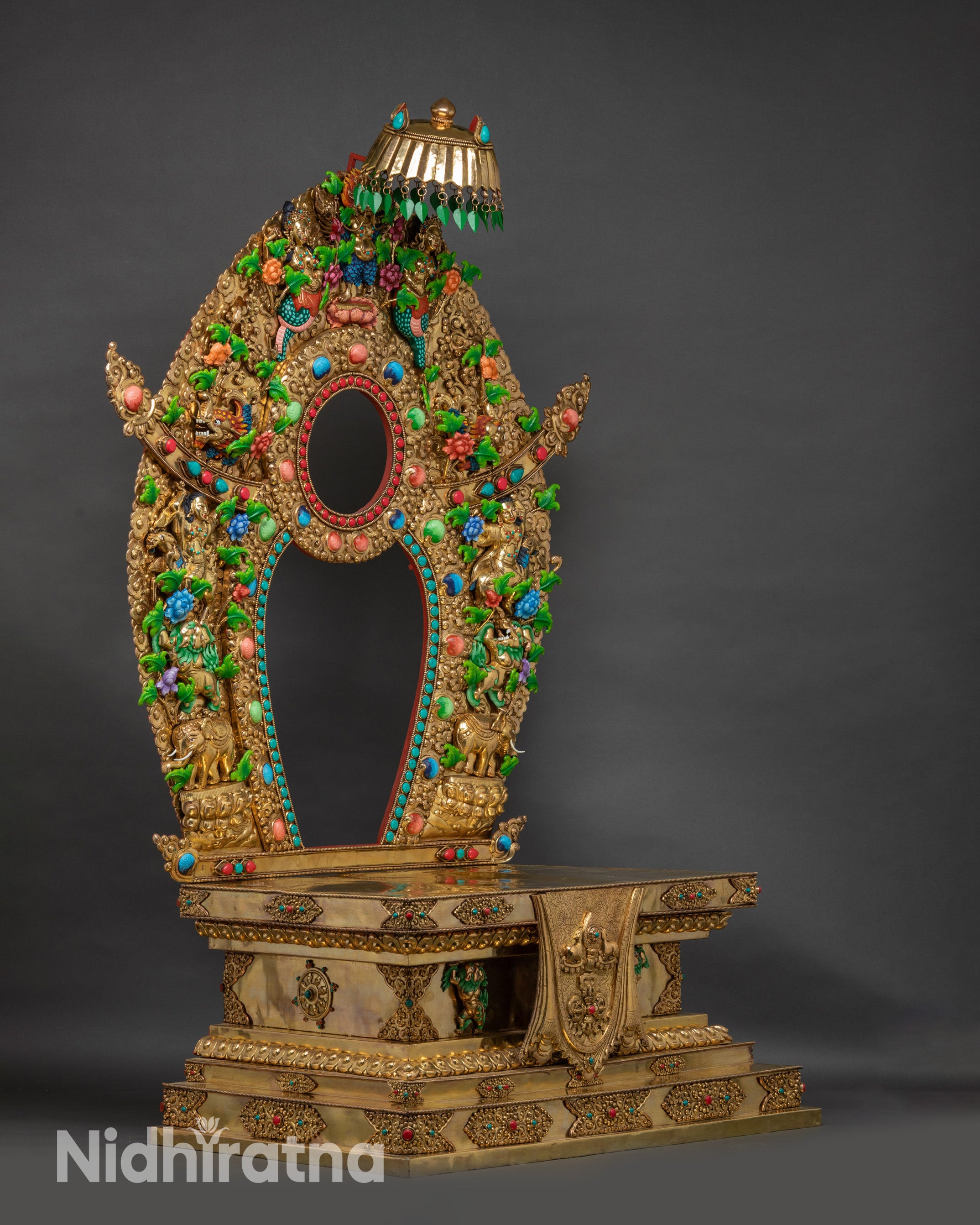 Side view Vajrayana throne carved stepped tiers with floral reliefs and stone inlays