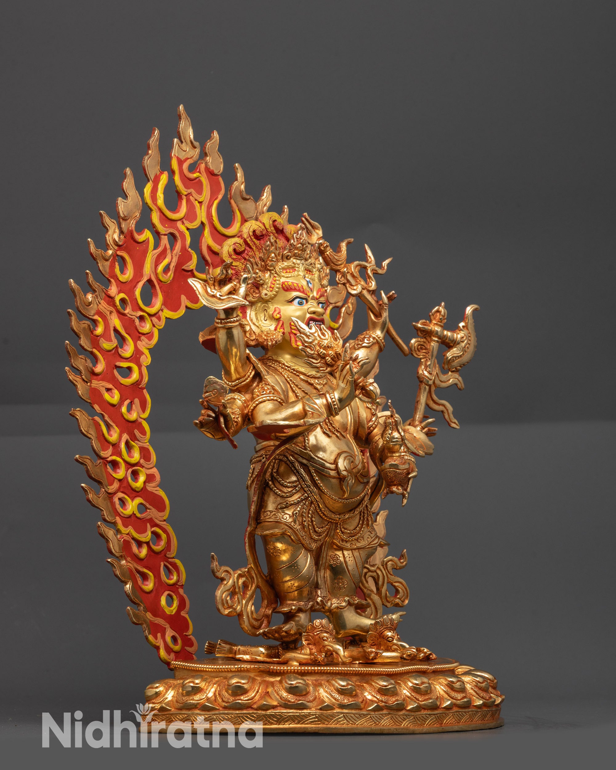 Side view White Mahakala Figure with flowing robes, intricate carvings, and semi-precious stones