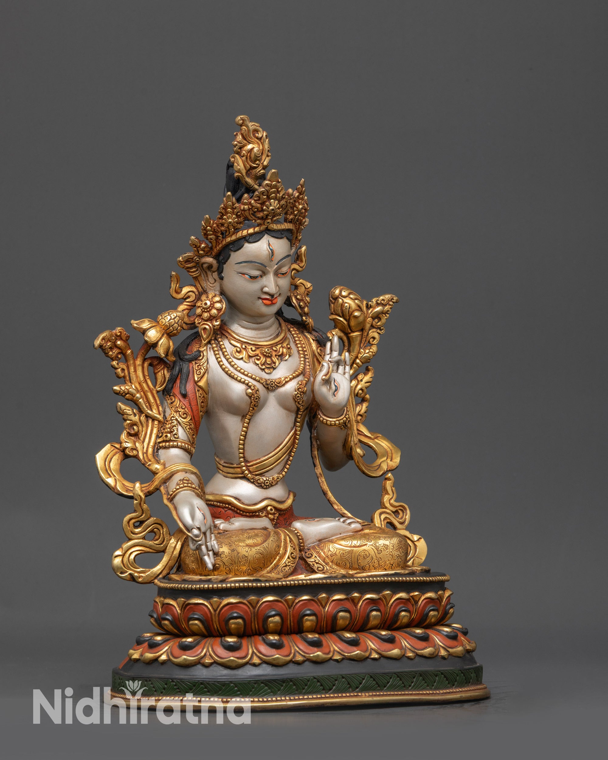 Side view White Tara sculpture with floating robe and utpala flower