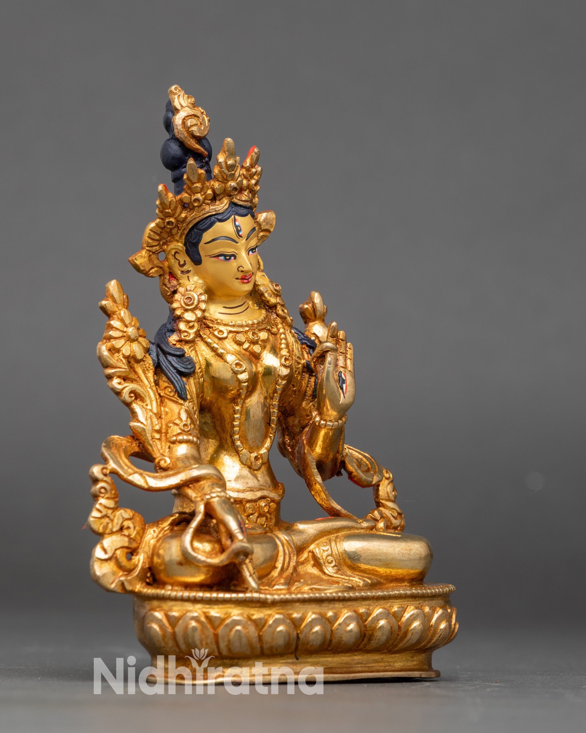 Side view White Tara statue mudras compassion healing and spiritual protection