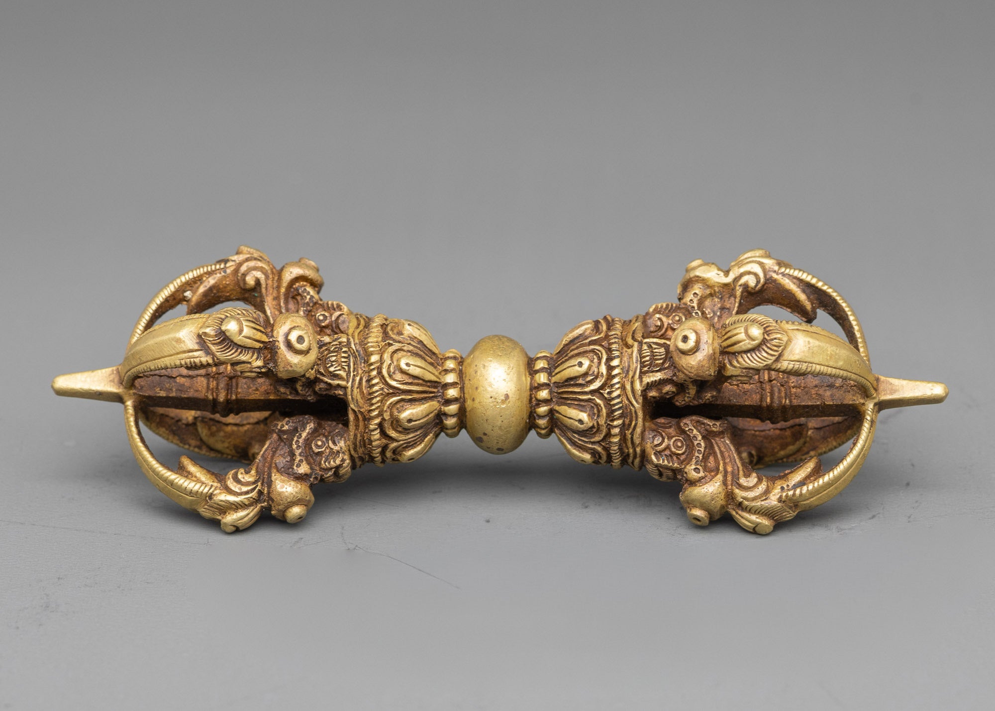Side view copper vajra symbolizing spiritual power and strength for altar use