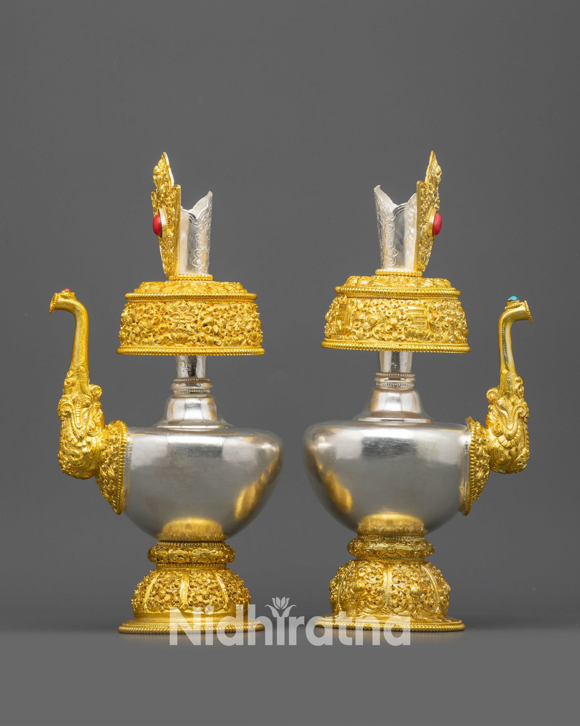 Side view curved body and gold-plated base of Bhumba vase pair