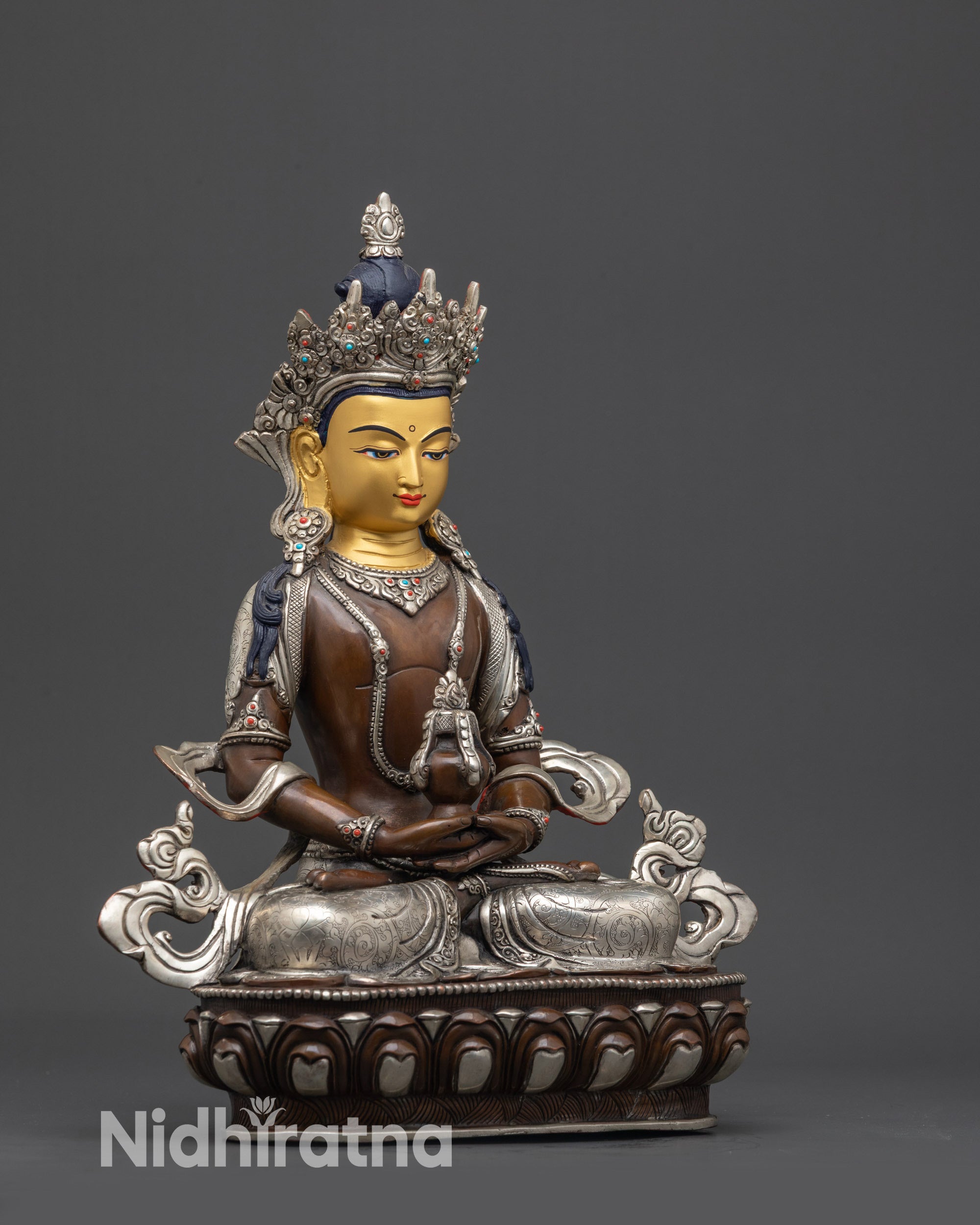 Side view handcrafted Amitayus statue with silver-plated accents, lotus-moon throne, sacred art