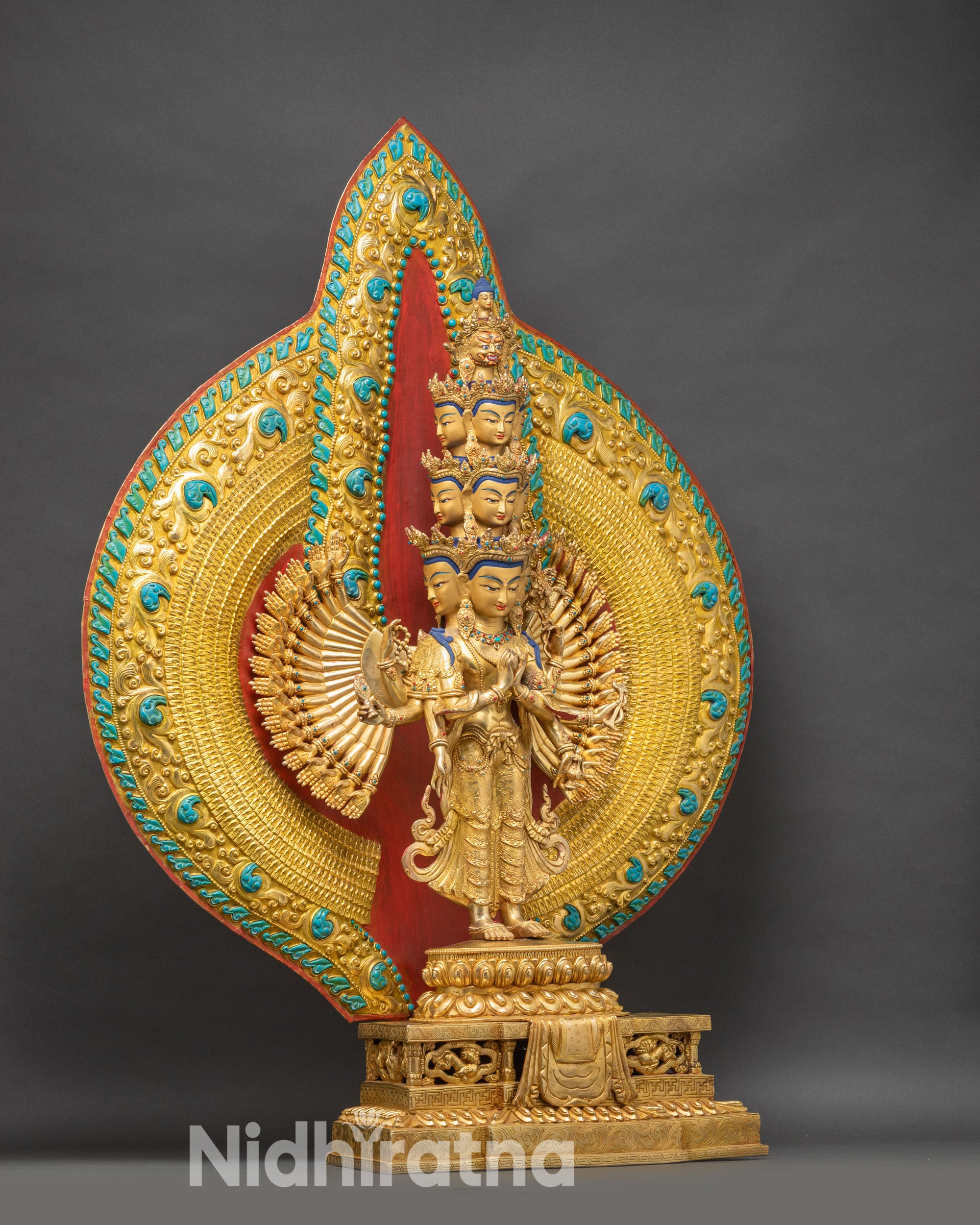 Side view of 11-headed Chenrezig – handcrafted copper and gold fire-gilded Bodhisattva with layered aureole halo.