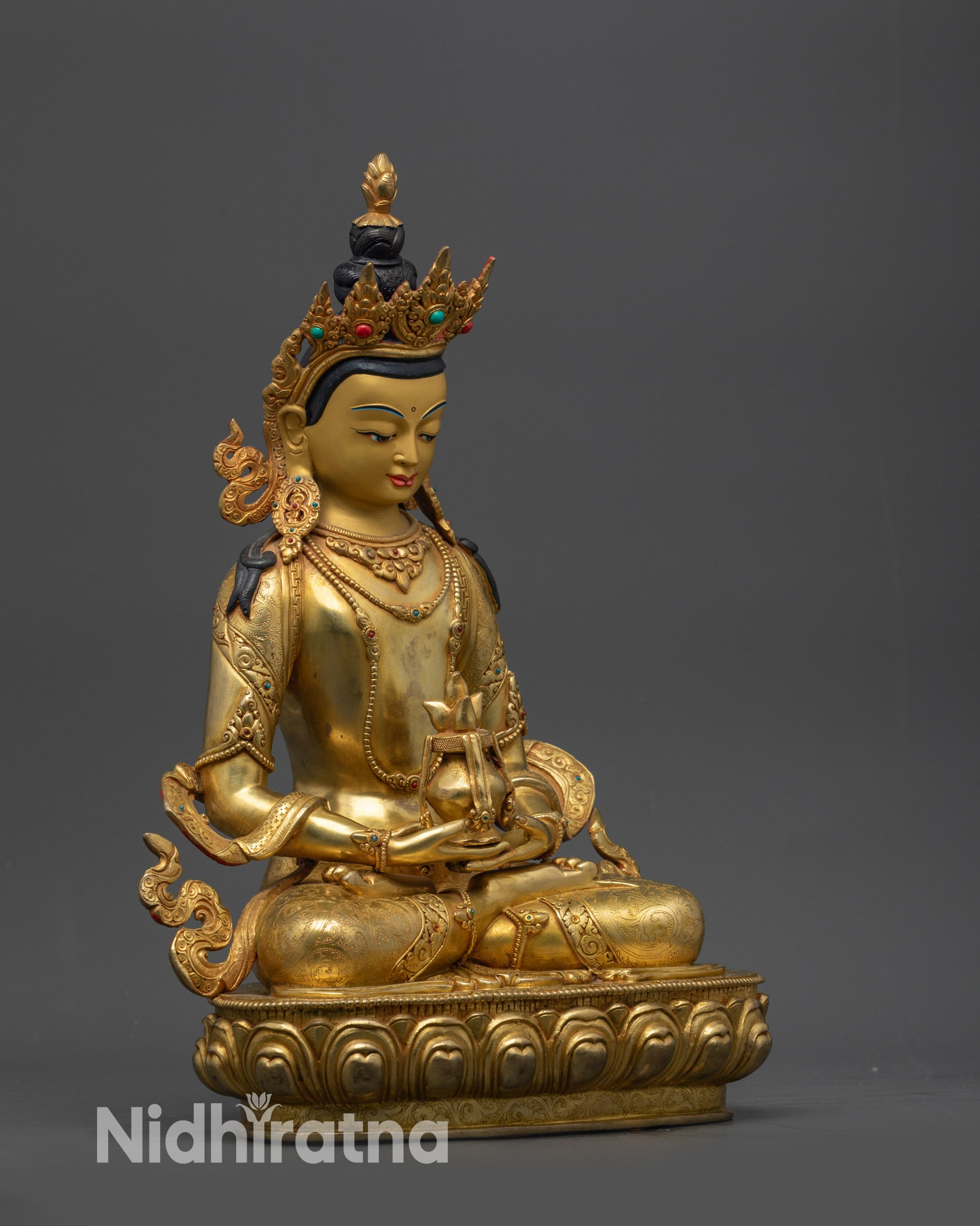 Side view of Amitayus sculpture showing nectar vase and intricate carvings