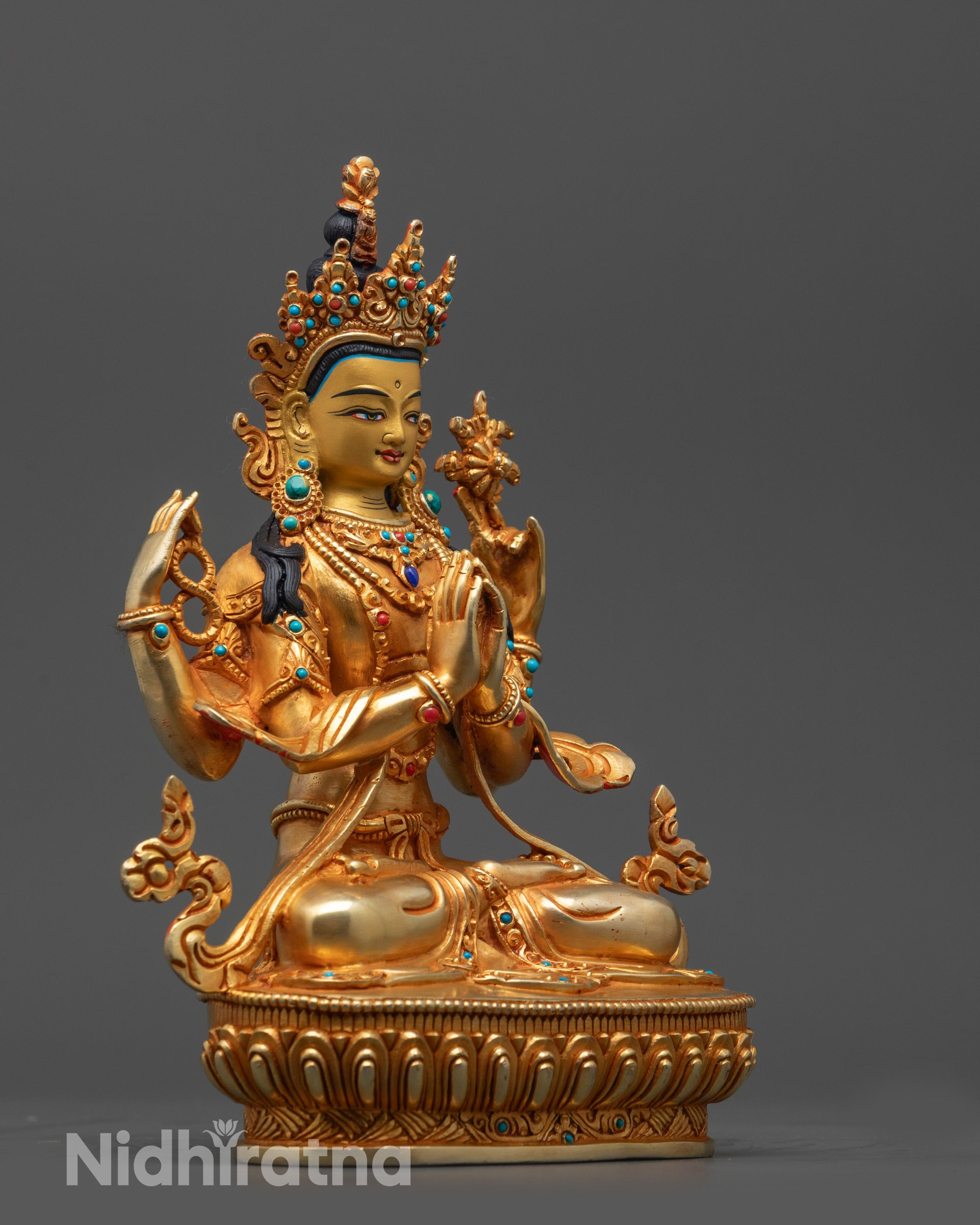 Side view of Avalokiteshvara statue with flowing robe five-jeweled crown and deer skin