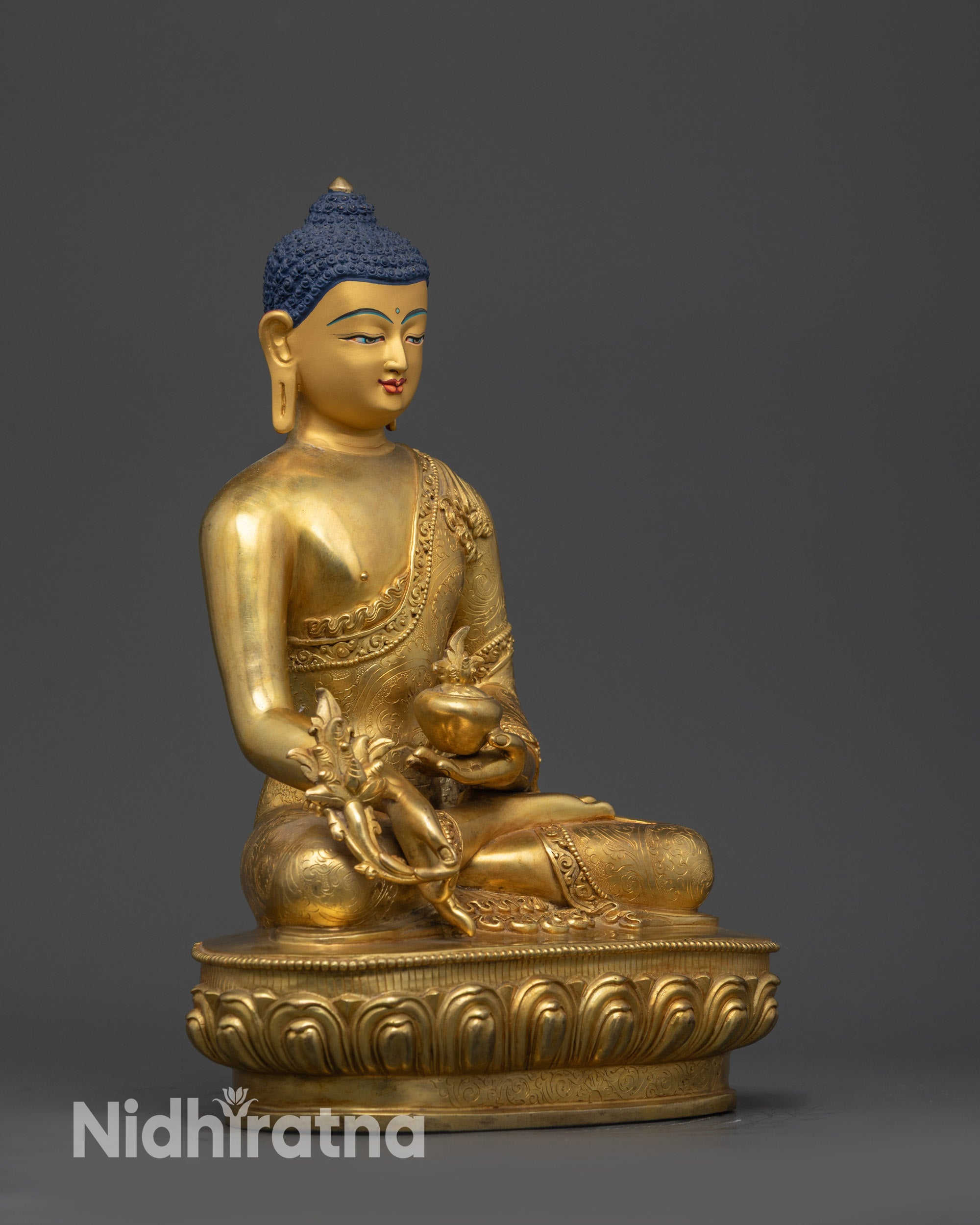 Side view of Bhaisajyaguru Statue holding myrobalan vase and stem on lotus seat