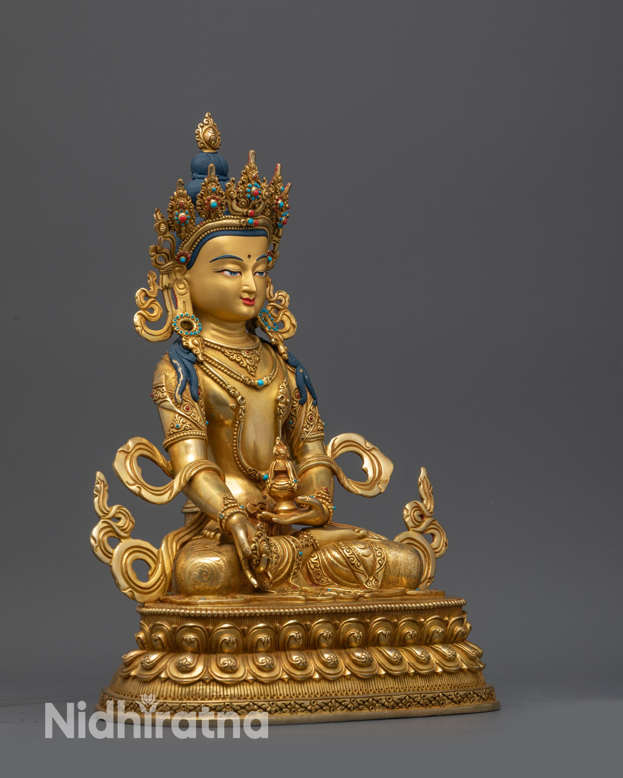 Side view of Bodhisattva Jizo Ksitigarbha statue holding chintamani on lotus pedestal