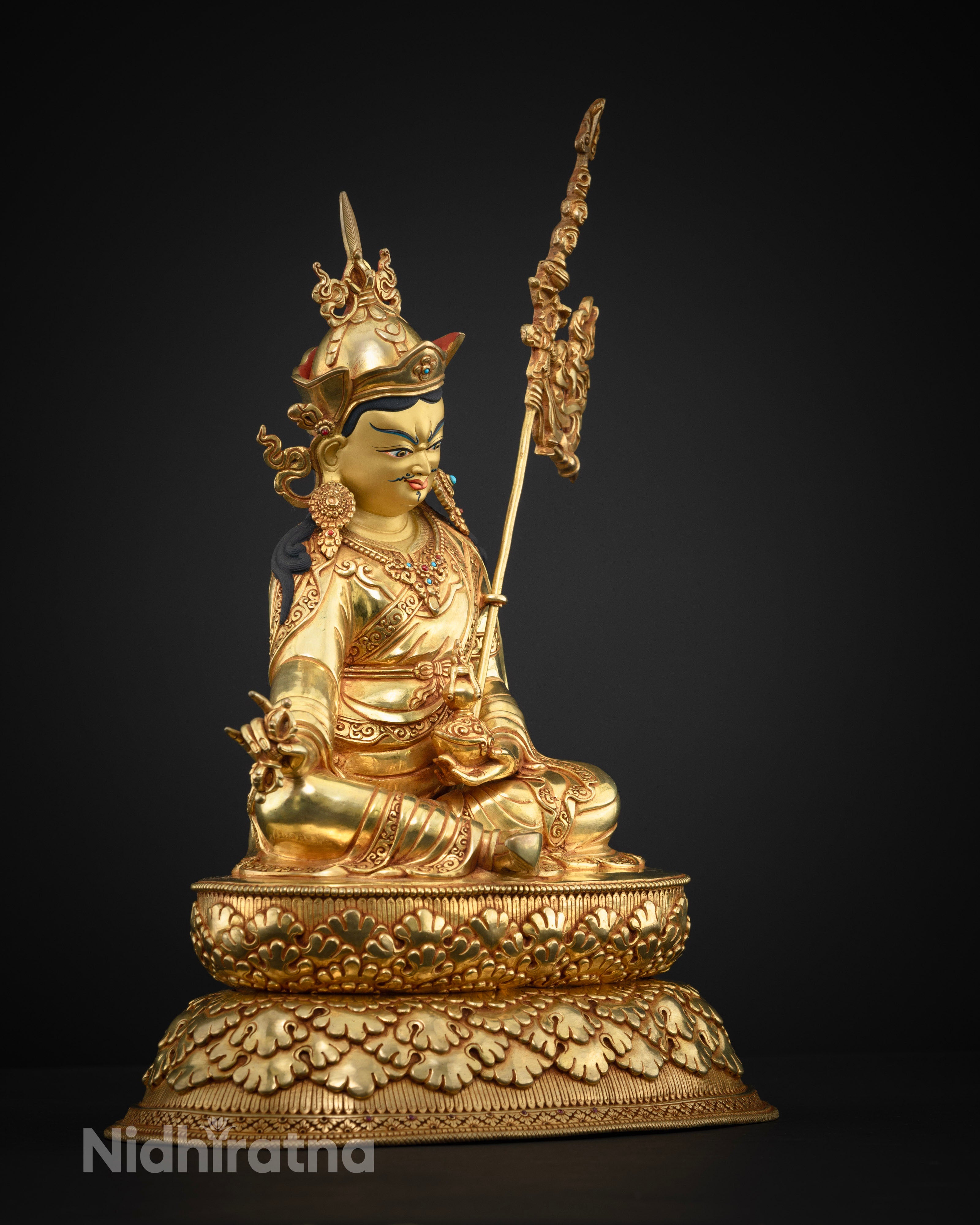 Side view of Copper Guru Rinpoche statue featuring fire-gilded 24k gold and hollow chamber
