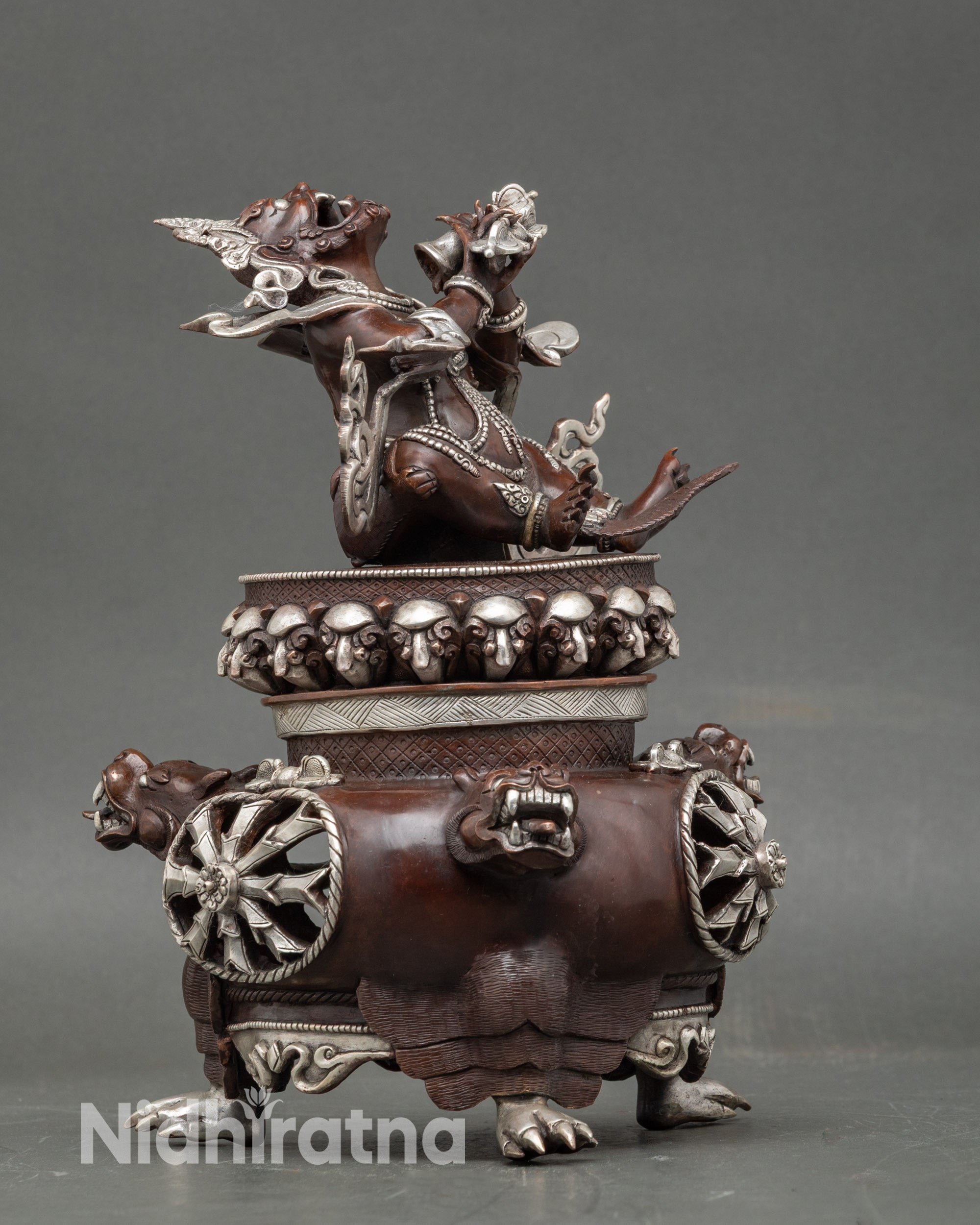 Side view of Dorje Khandro incense burner with intricate protective motifs and sacred ornamentation