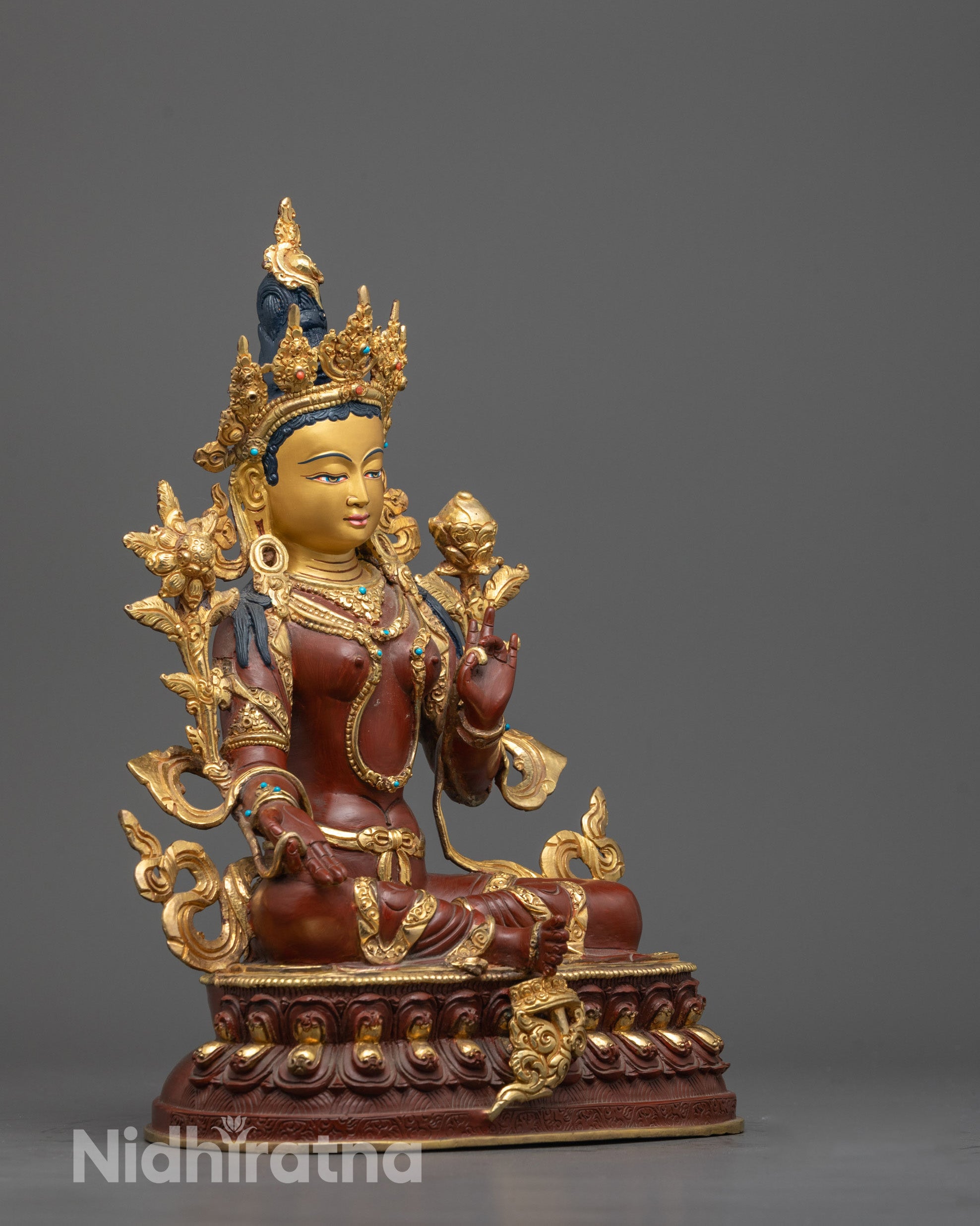 Side view of Elegant Green Tara Buddha statue hand-crafted with gold accents
