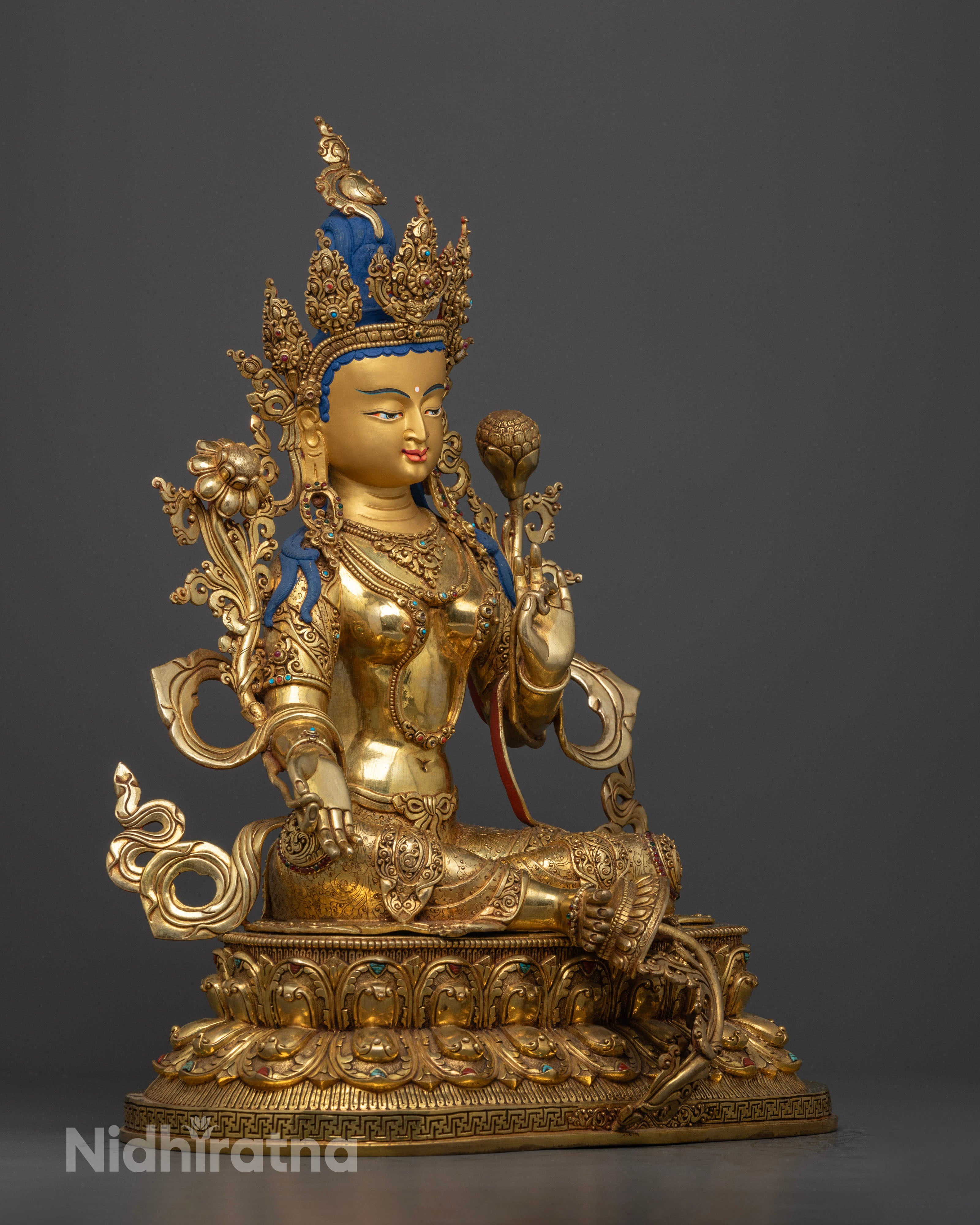 Side view of Green Tara meditation statue with extended leg, gold-gilded copper for spiritual protection