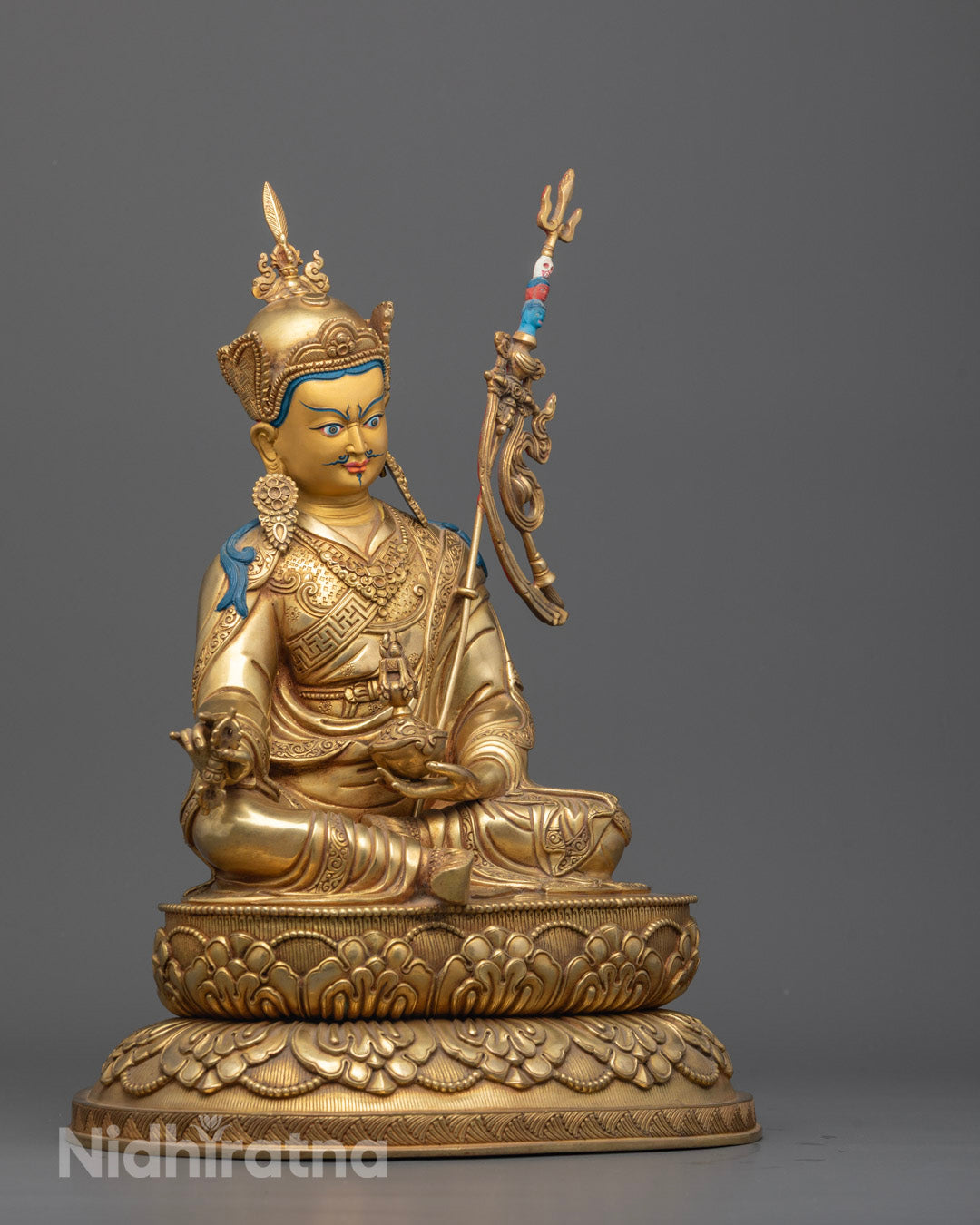 Side view of Guru Rinpoche Statue highlighting intricate copper carving