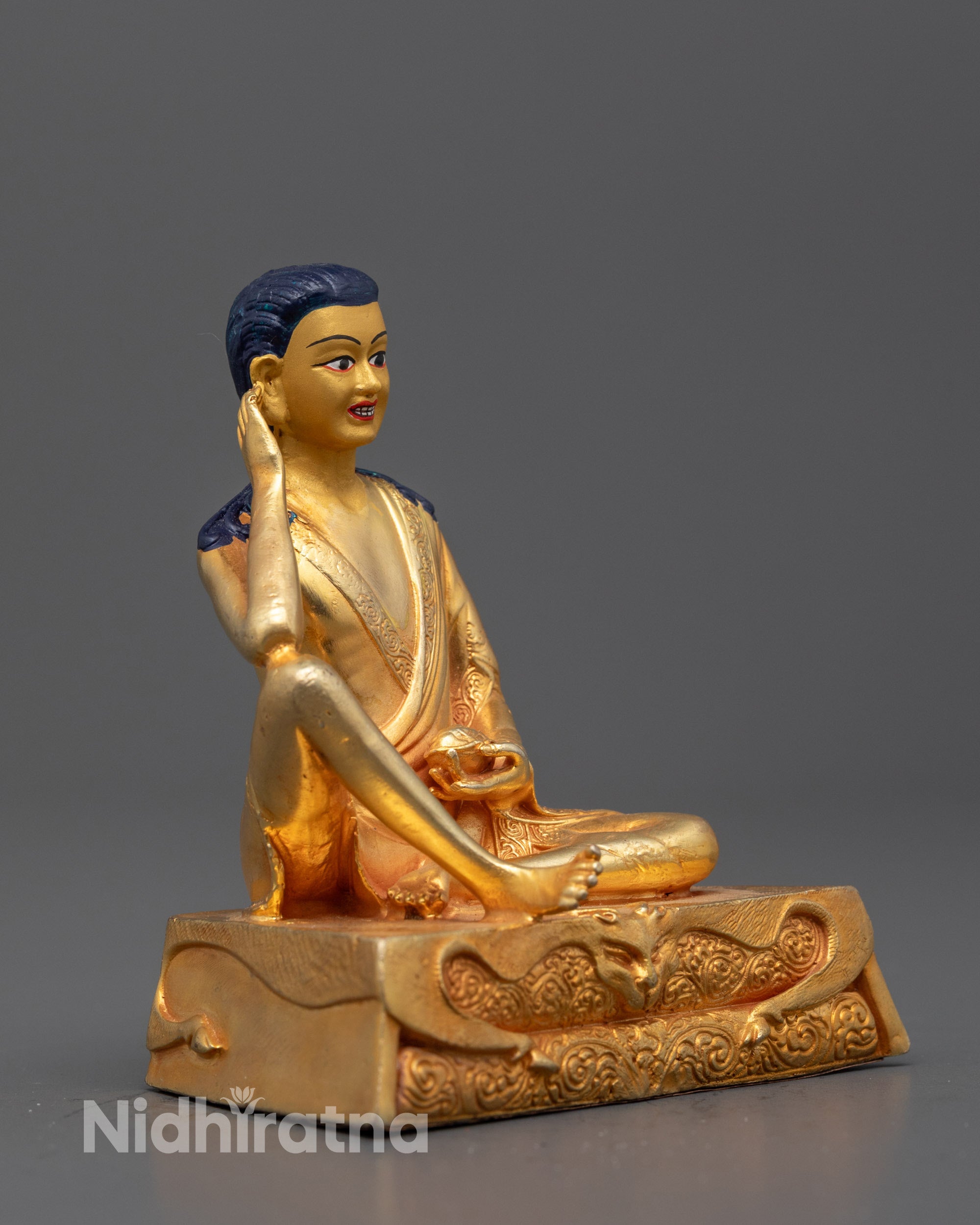 Side view of Handcrafted Milarepa Buddha statue with intricate robes and spiritual expression