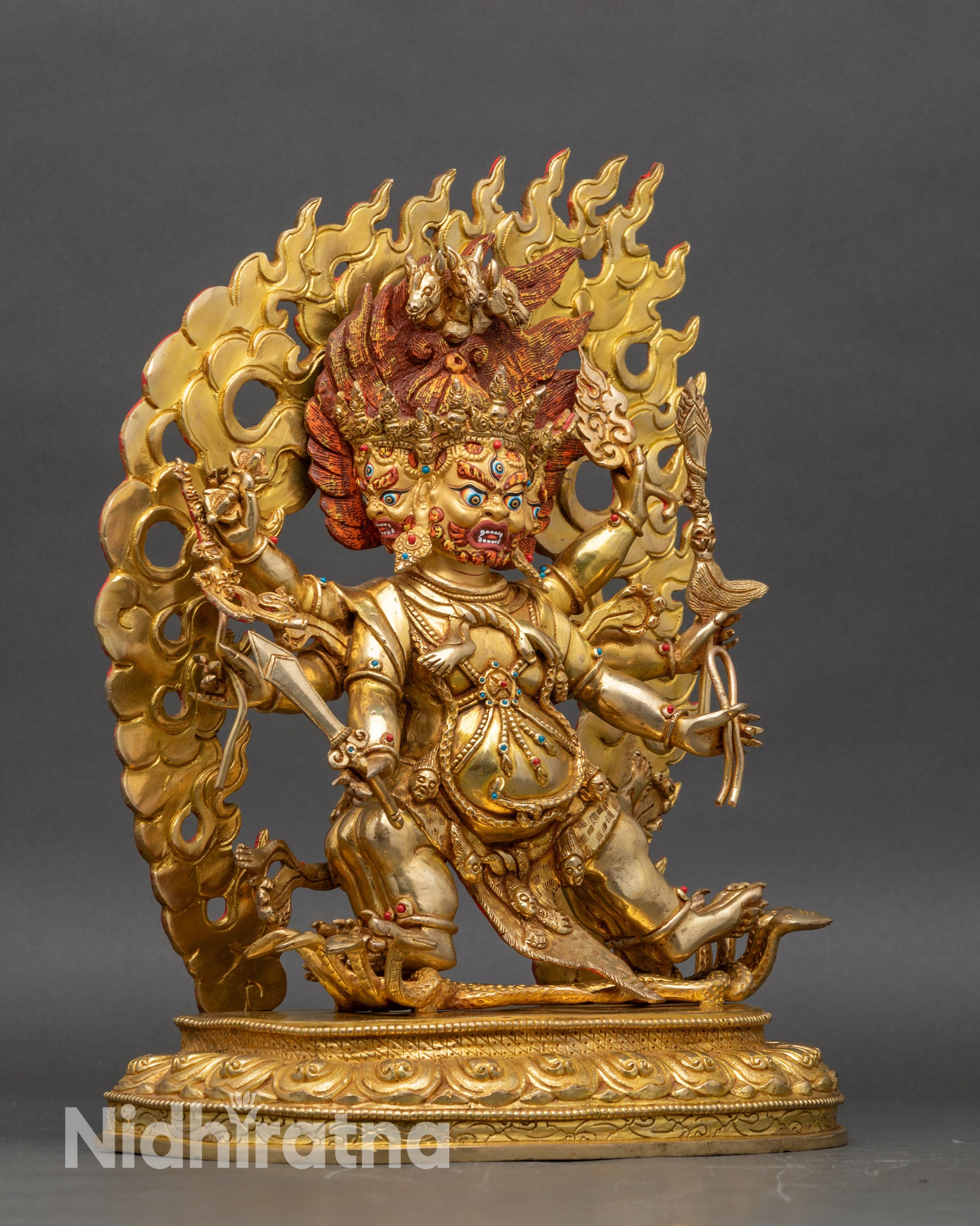 Side view of Hayagriva sculpture, coiled serpent and tiger skin garments visible