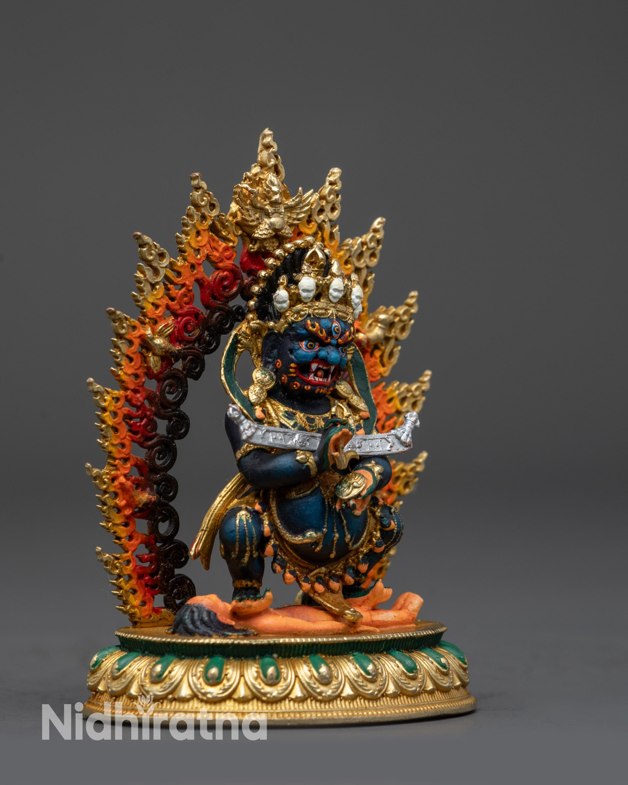 Side view of Himalayan Sakya Mahakala copper statue with vibrant acrylic colors