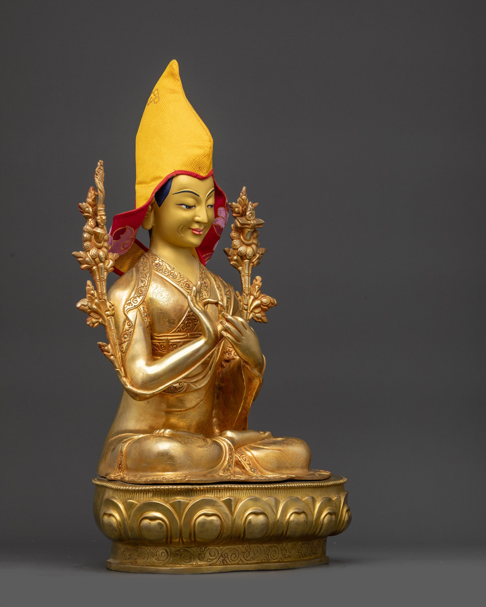 Side view of Je Tsongkhapa statue showcasing detailed monastic robes, gold-gilded copper body, and lotus throne.