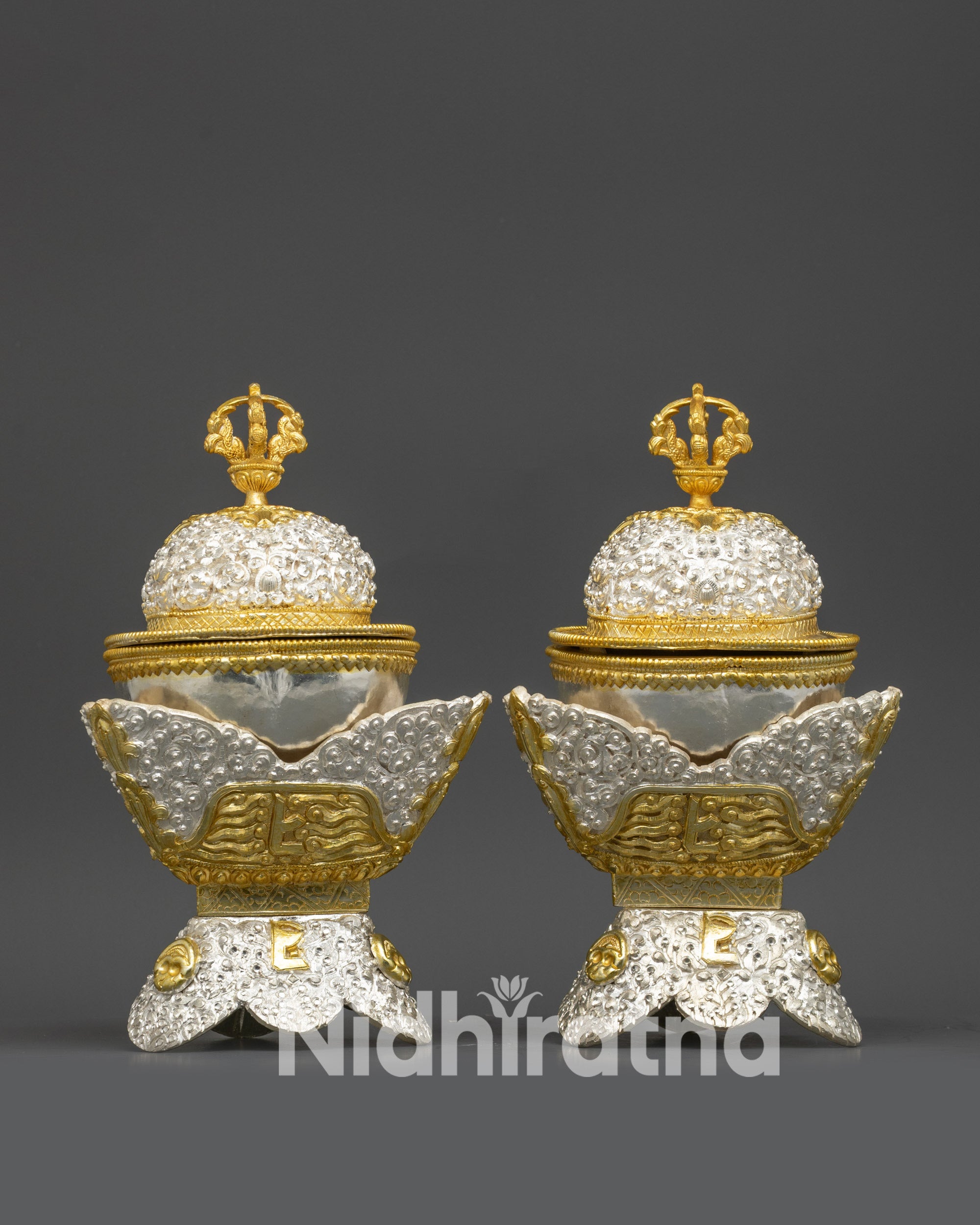 Side view of Kapala set displaying dual-section silver and gold filigree pattern