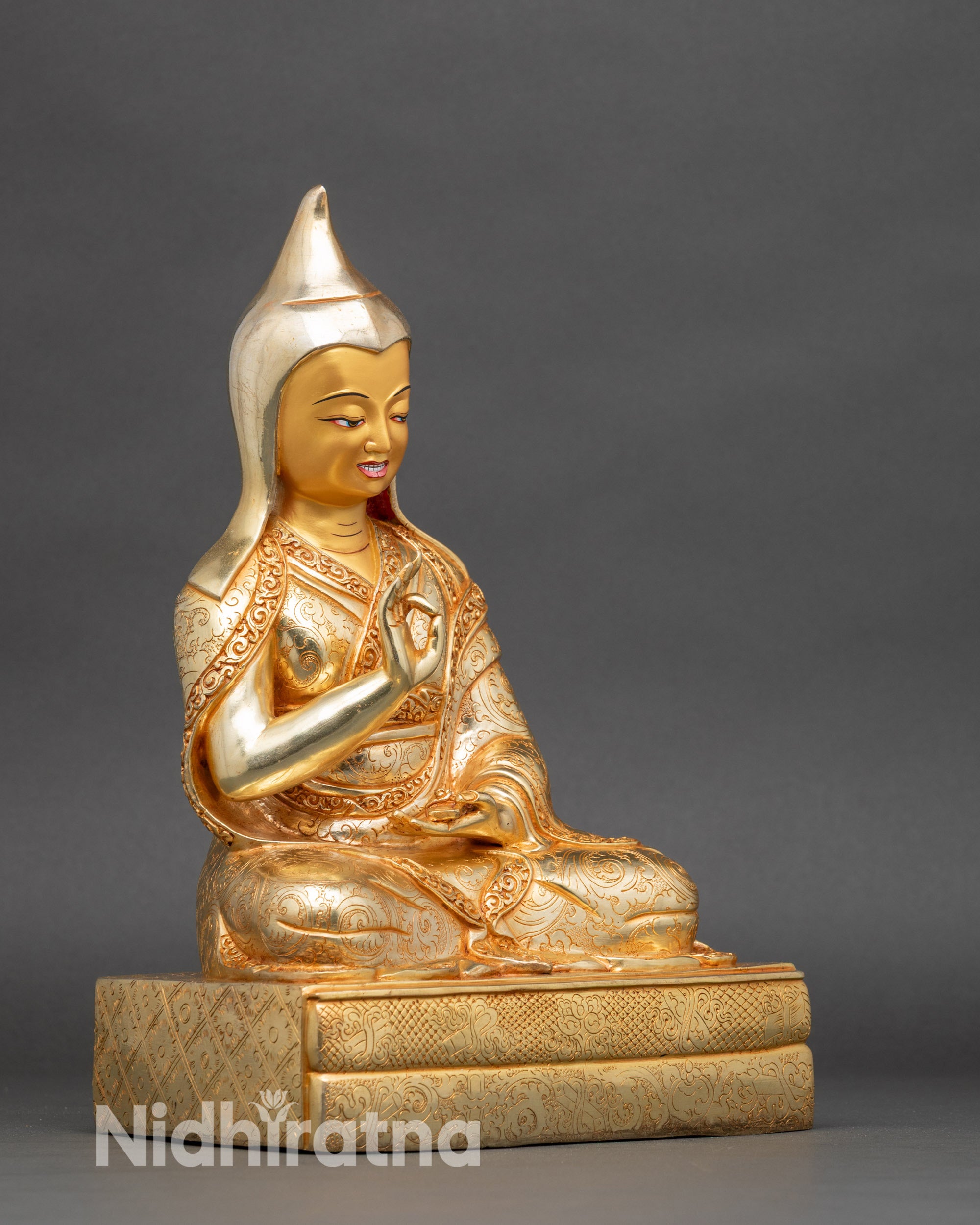 Side view of King Trisong Detsen seated, showing detailed robes and ornaments