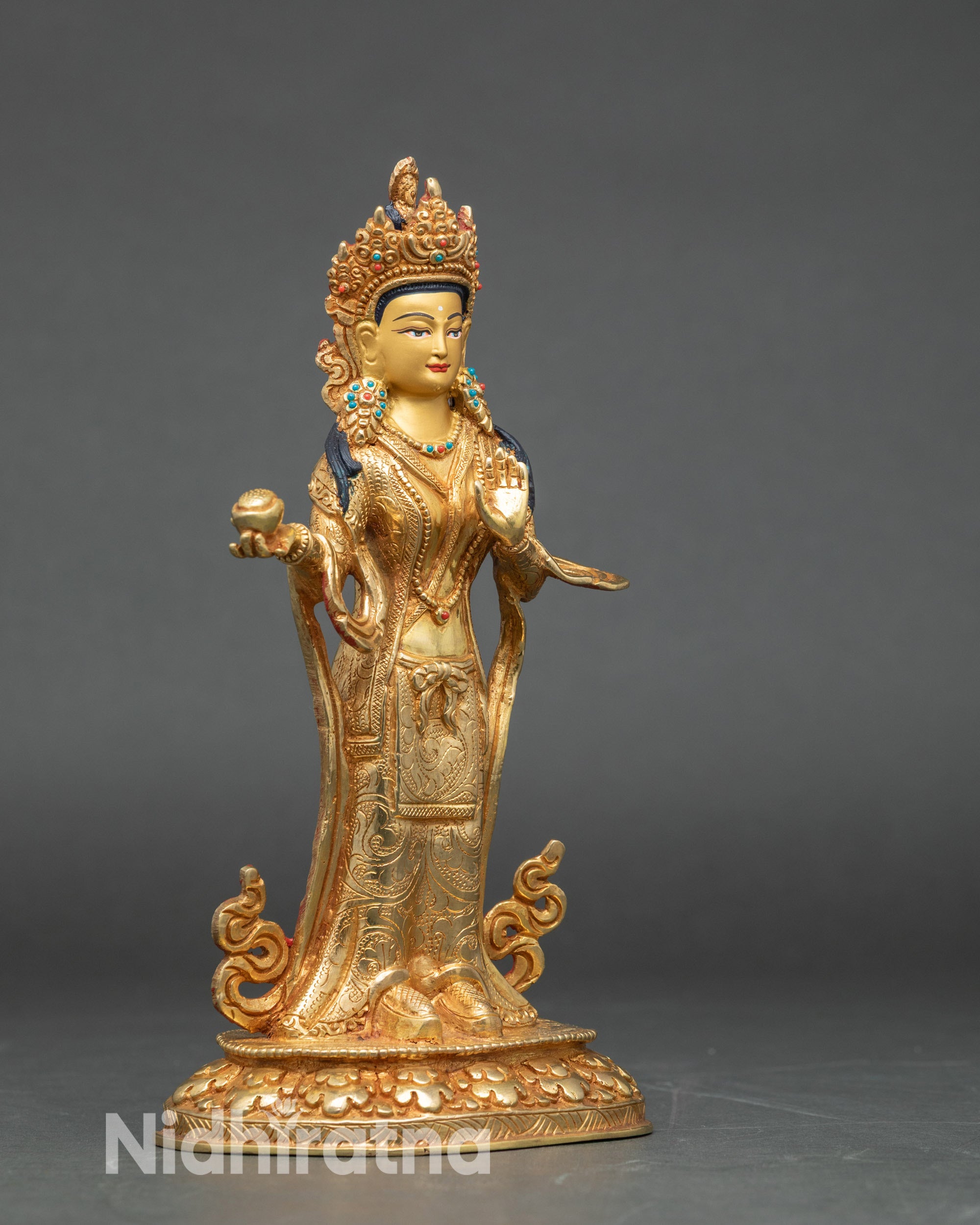 Side view of Mandarva statue highlighting symbolic attributes and craftsmanship