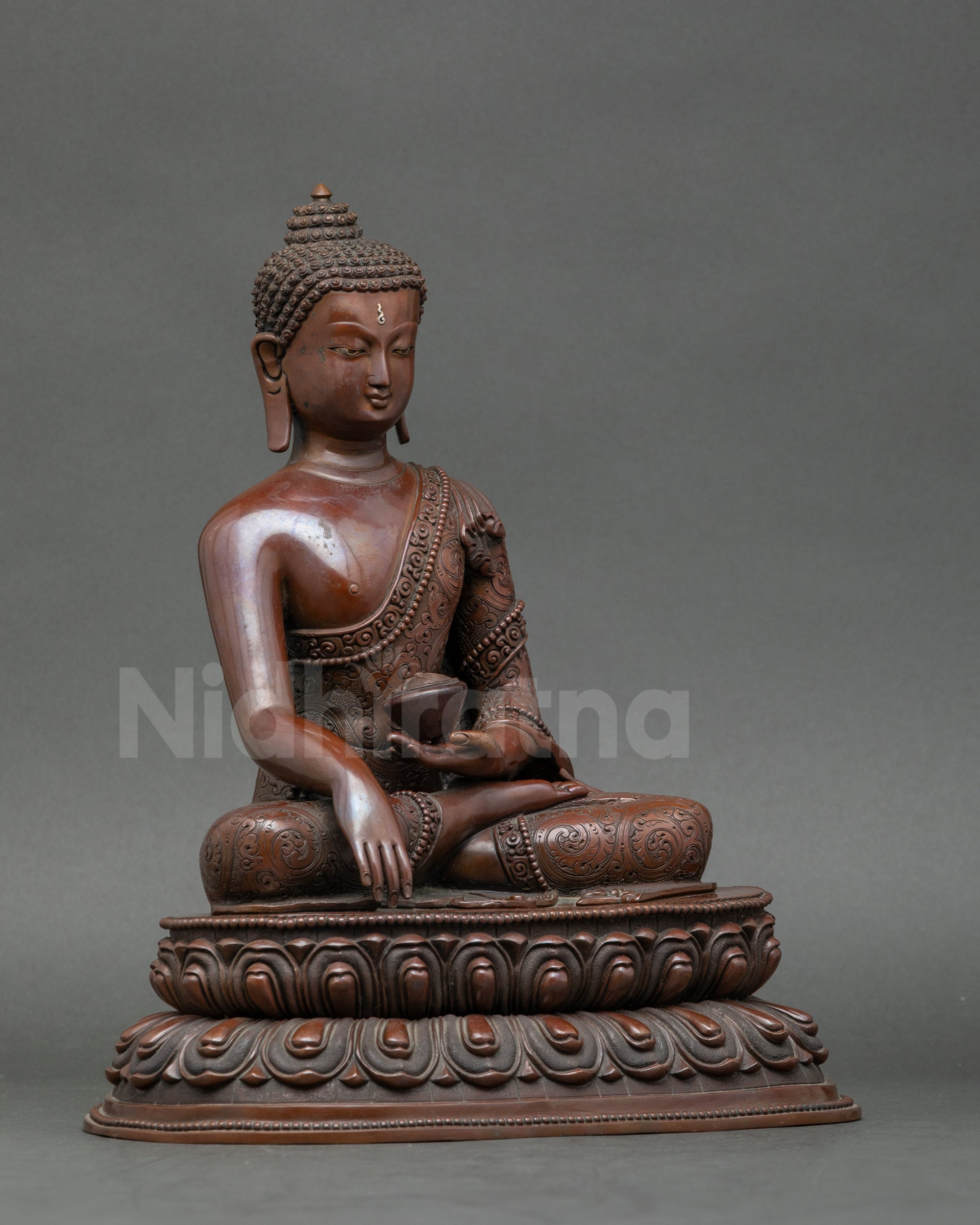 Side view of Nepalese Buddha Shakyamuni statue, traditional lost-wax craftsmanship